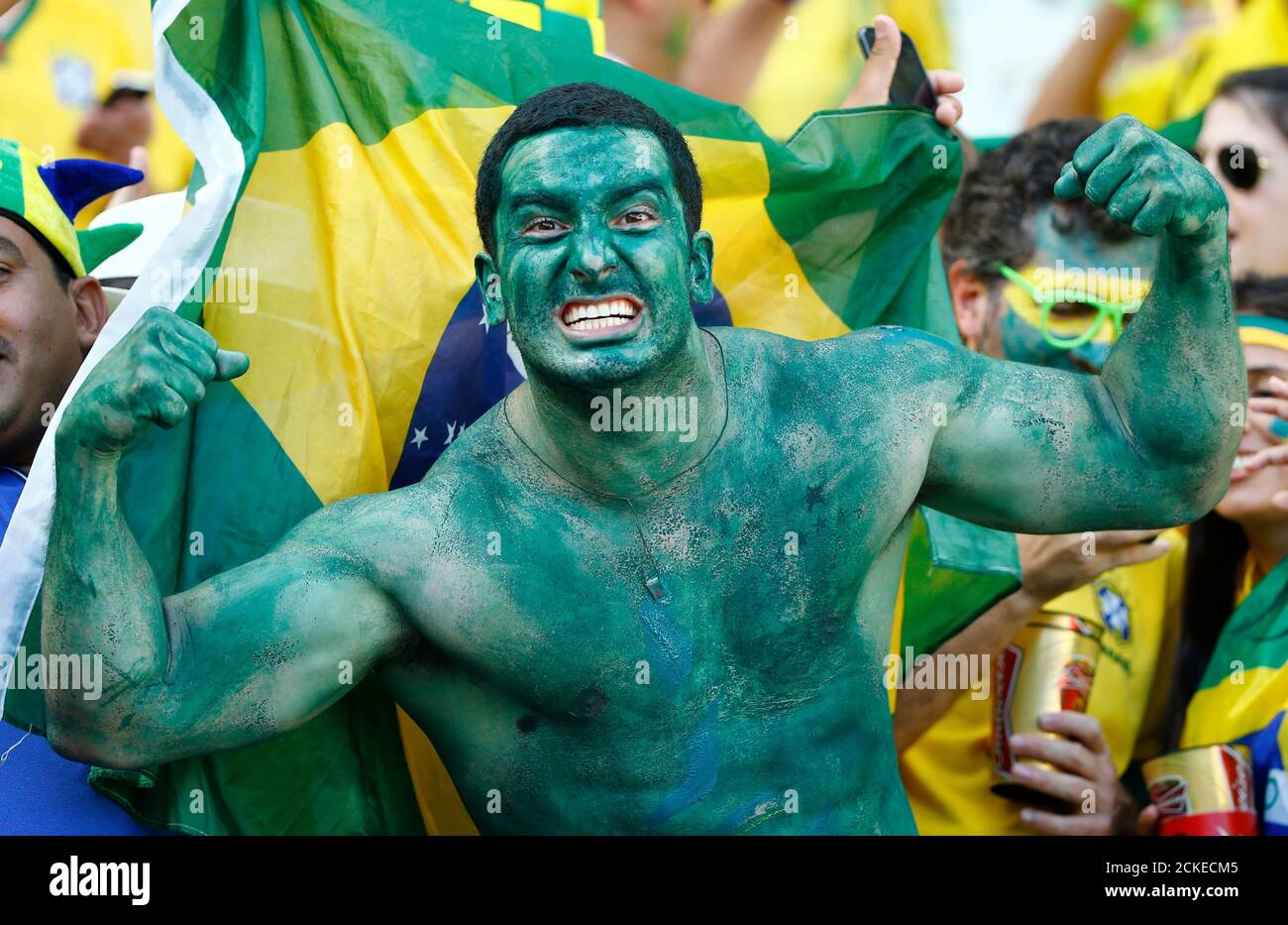 A Brazil fan poses before the 2014 World Cup quarter-finals between Brazil and Colombia at the Castelao arena in Fortaleza July 4, 2014. REUTERS/Stefano Rellandini (BRAZIL  - Tags: SOCCER SPORT WORLD CUP) Stock Photo