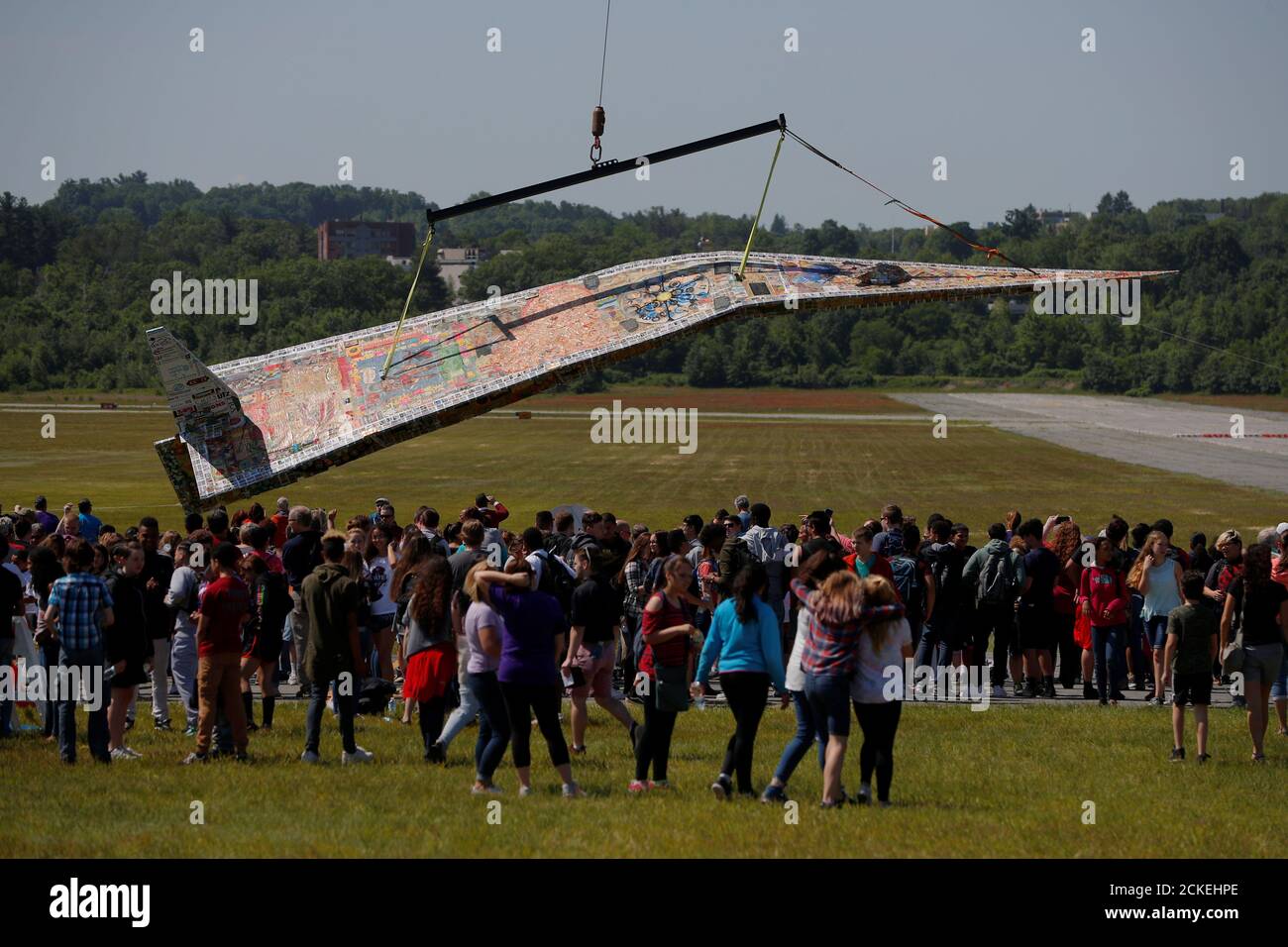 A crowd arrives to see the Revolving Museum's 64plus foot long paper