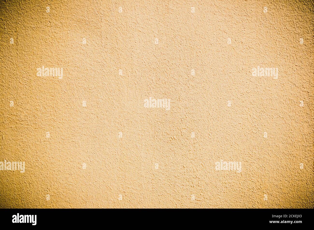 Cracked painted yellow concrete wall background or texture Stock Photo