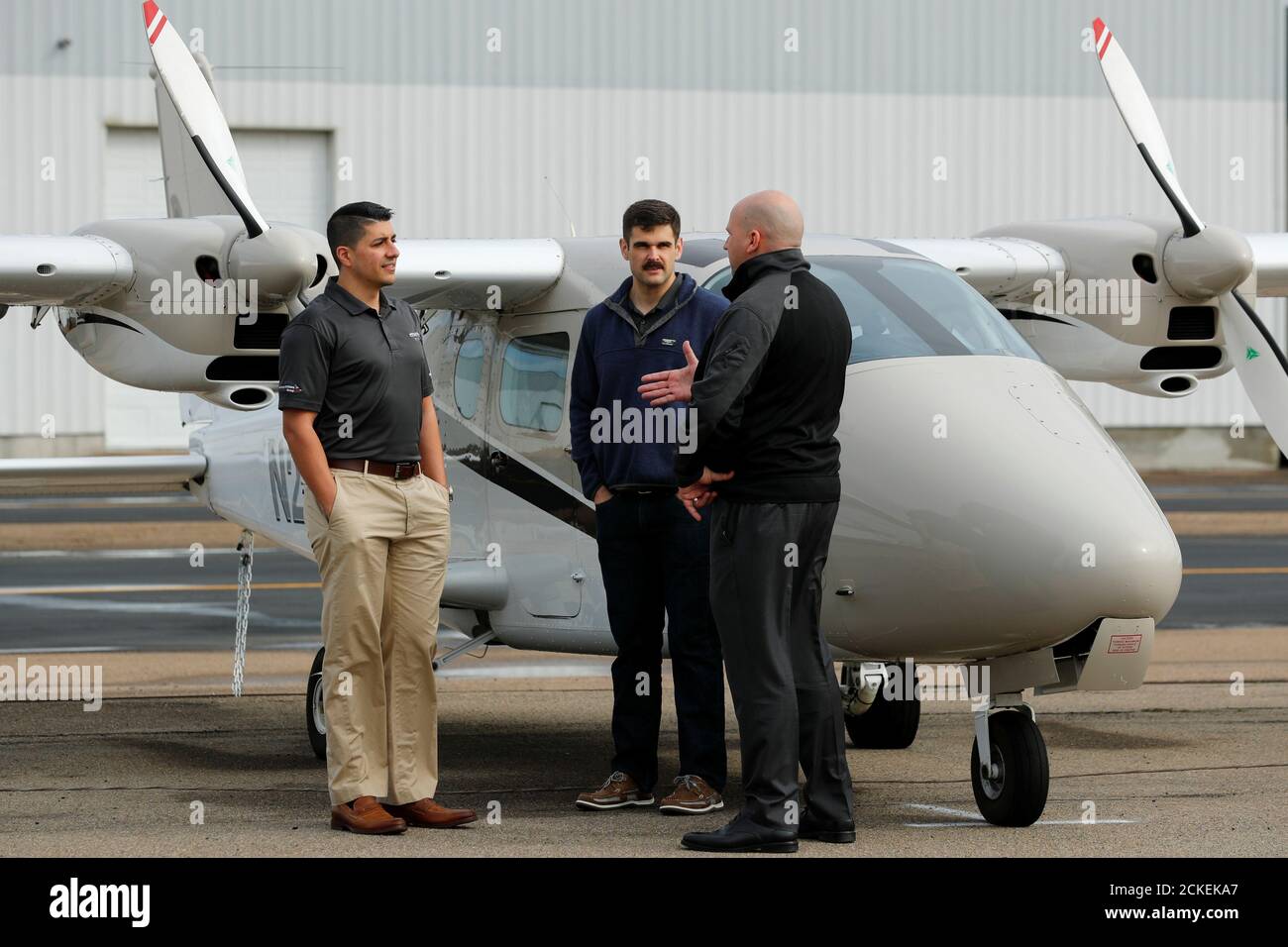 Coast Flight Training president Bryan Simmons talks with military helicopter  pilots Dominic Cipolla and Henery Jacobs who are training at his companies  facility in San Diego, California, U.S., January 15, 2019. Picture