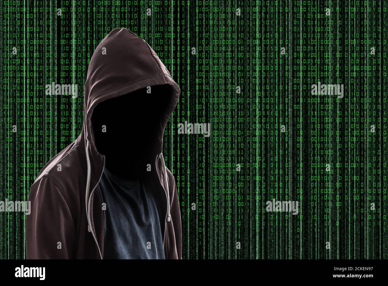 Invisibla man wearing a hoodie on Matrix style background Stock Photo