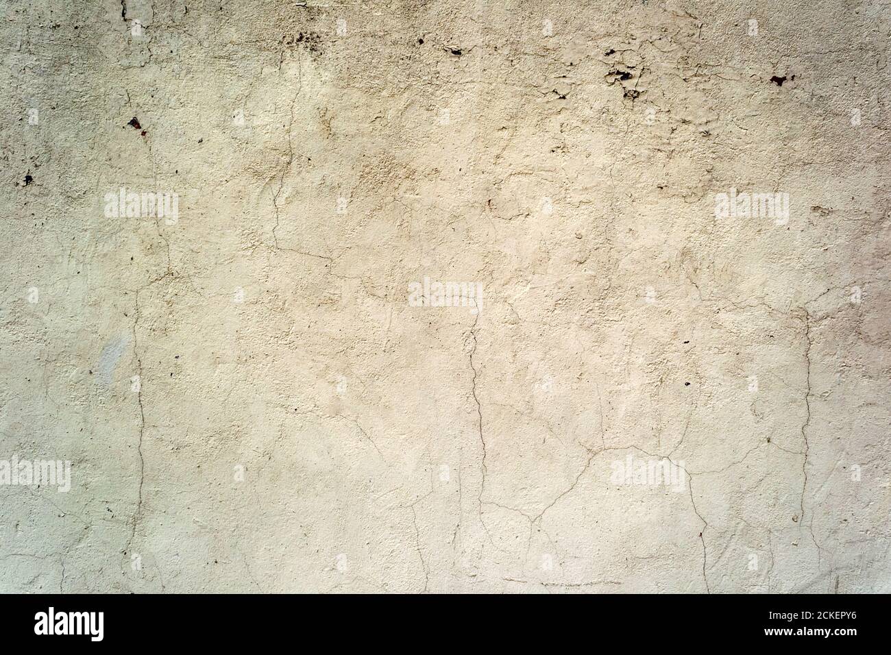 Cracked concrete painted wall background or texture. Close-up Stock Photo