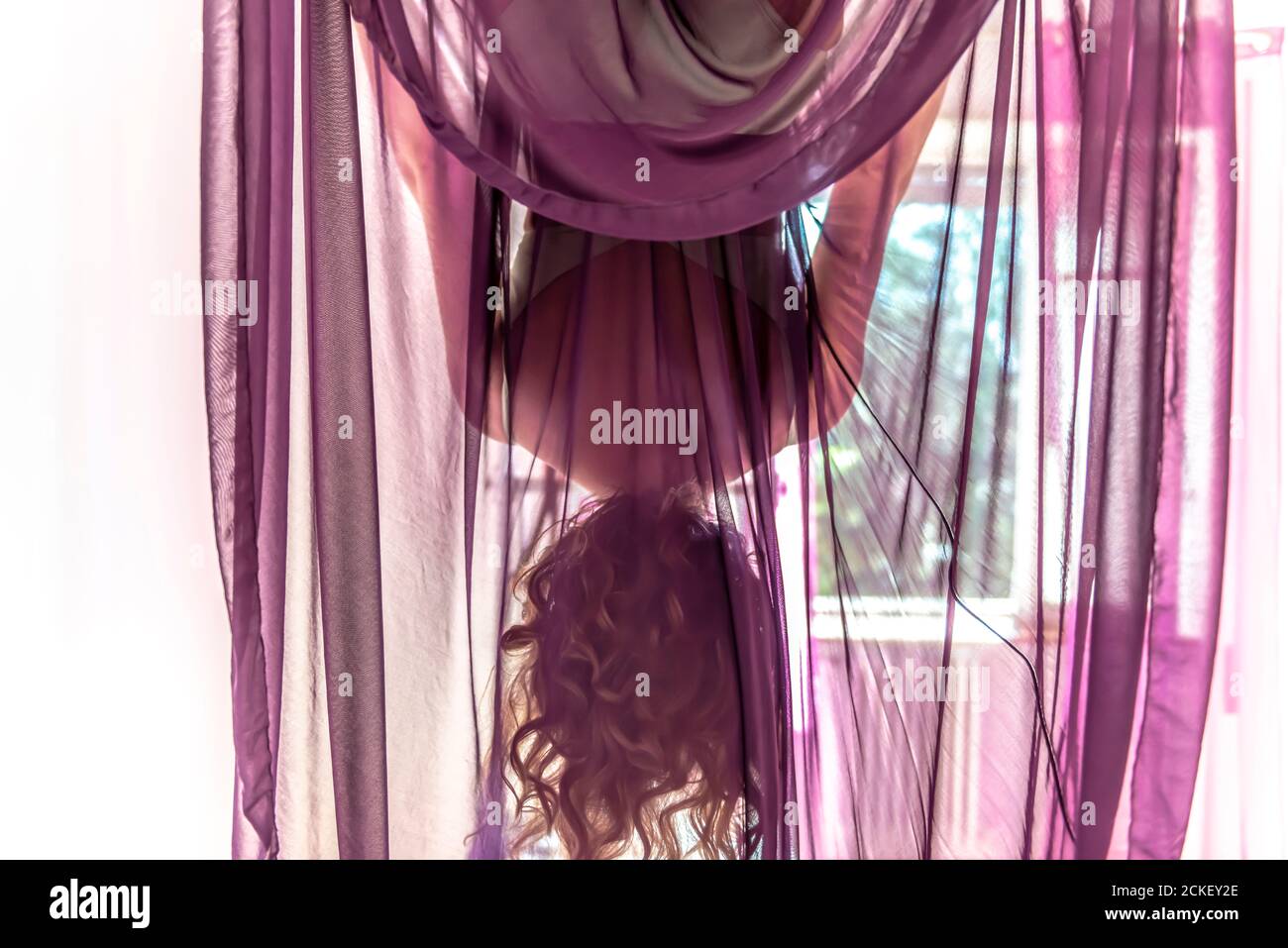 Woman hanging upside down hi-res stock photography and images - Alamy