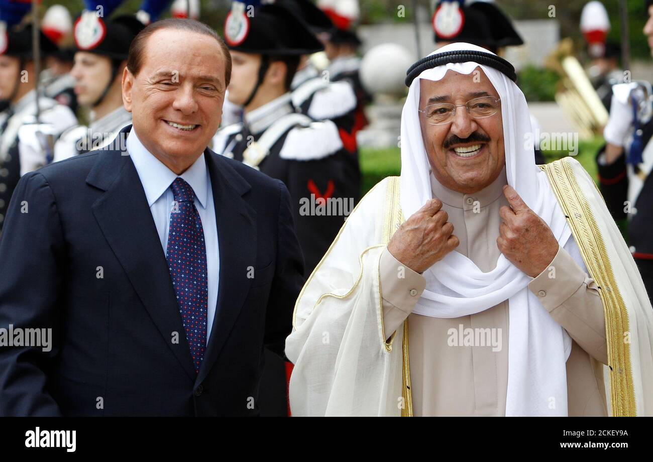 Italian Prime Minister Silvio Berlusconi ( L) arrives with Emir of Kuwait, Sheikh Sabah Al-Ahmad Al-Jaber for a meeting at Villa Madama in Rome May 4, 2010.  REUTERS/Max Rossi   (ITALY - Tags: POLITICS) Stock Photo