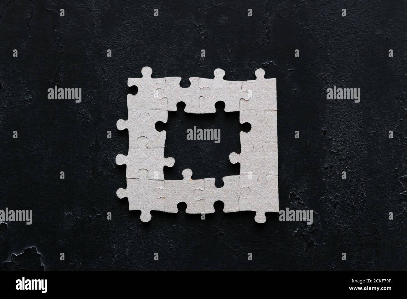 puzzle with missing parts on black background business concept Stock ...