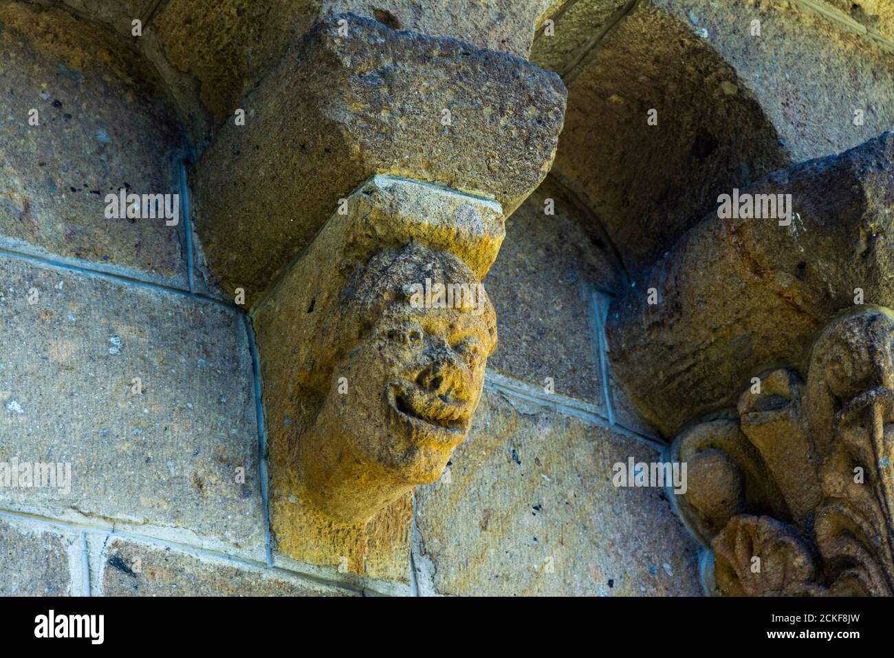 Ydes Bourg,  sculptures of Church Saint-Georges, Cantal department, Auvergne-Rhone-Alpes, France Stock Photo