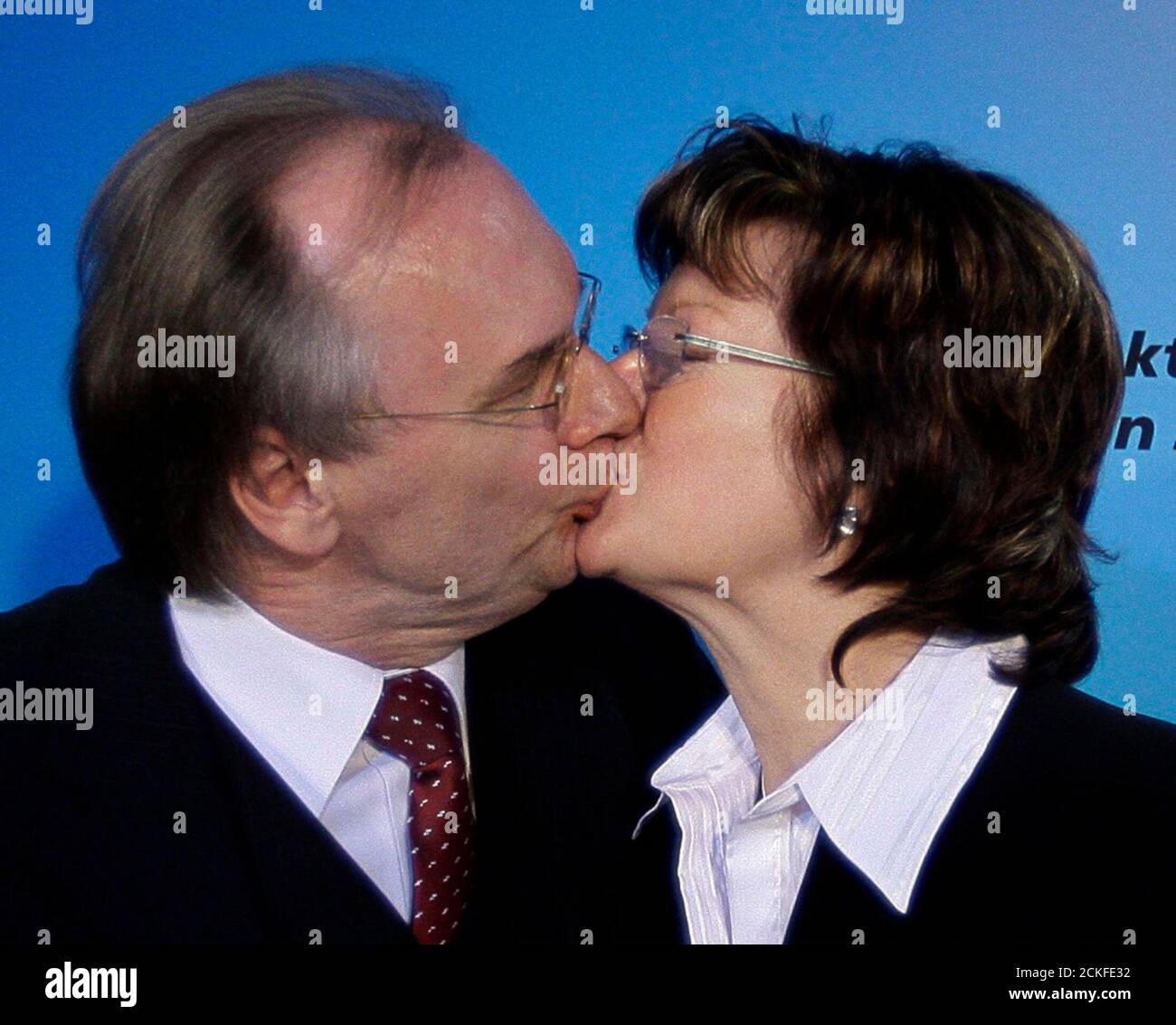 Reiner Haseloff, top candidate  of the Christian Democratic Union (CDU) in Saxony-Anhalt state election, kisses his wife Gabriele in Magdeburg March 20, 2011. German Chancellor Angela Merkel began an electoral stress test on Sunday, with the first of three state polls when she may suffer a major setback despite a nuclear policy U-turn and military opt-out in Libya.     REUTERS/Thomas Peter (GERMANY  - Tags: POLITICS ELECTIONS POLITICS) Stock Photo