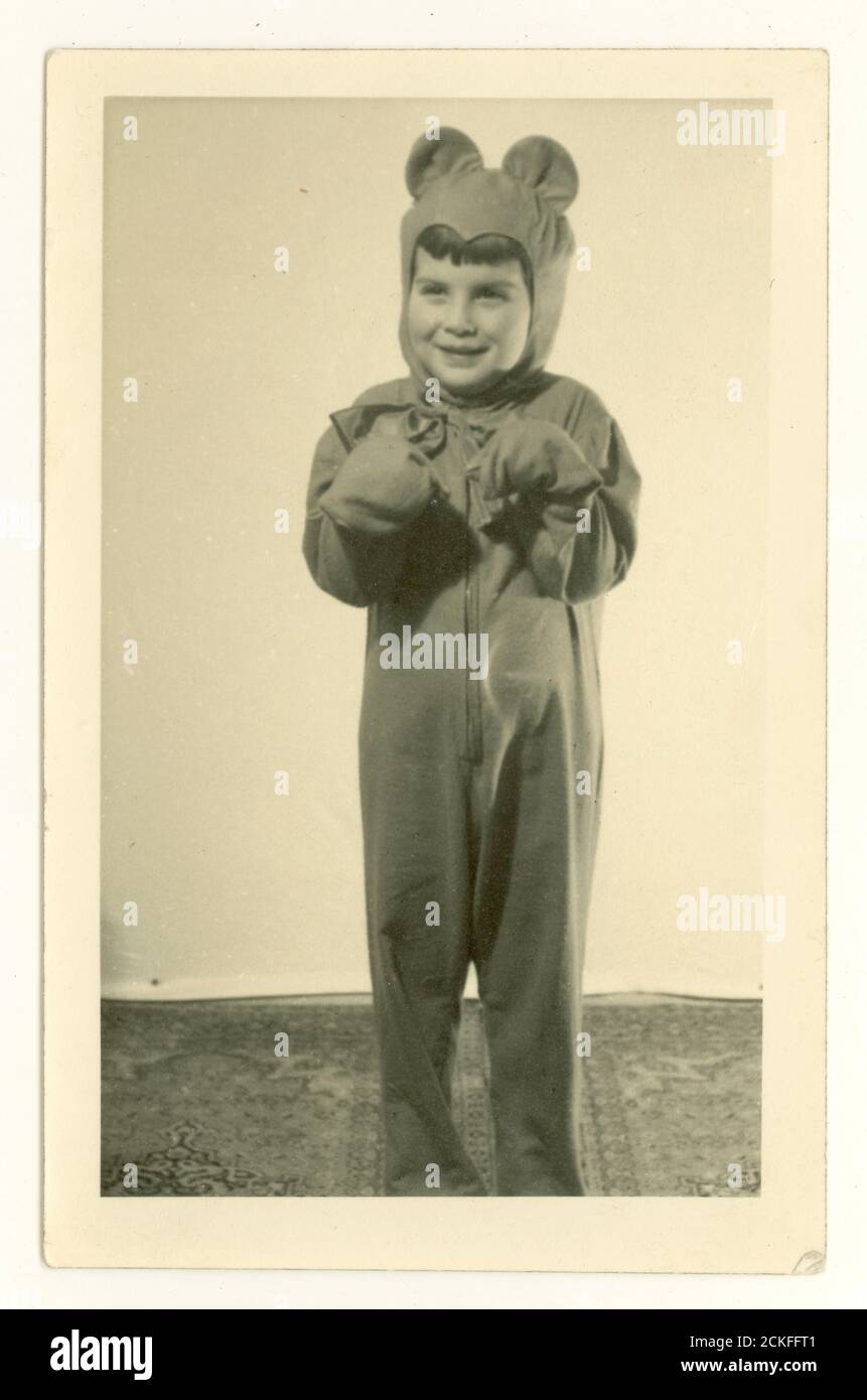 1950's portrait of young girl in fancy dress bear costume, U.K. Stock Photo
