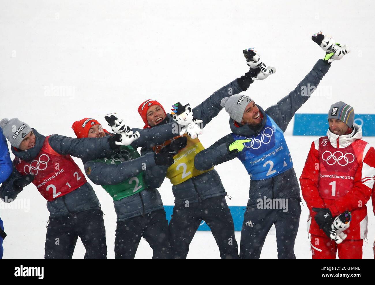 Nordic Combined Events - Pyeongchang 2018 Winter Olympics - Men's Team 4 x 5 km Final - Alpensia Cross-Country Skiing Centre - Pyeongchang, South Korea - February 22, 2018 -  Gold medallists Vinzenz Geiger, Fabian Riessle, Eric Frenzel and Johannes Rydzek of Germany celebrate during the flower ceremony. REUTERS/Carlos Barria Stock Photo