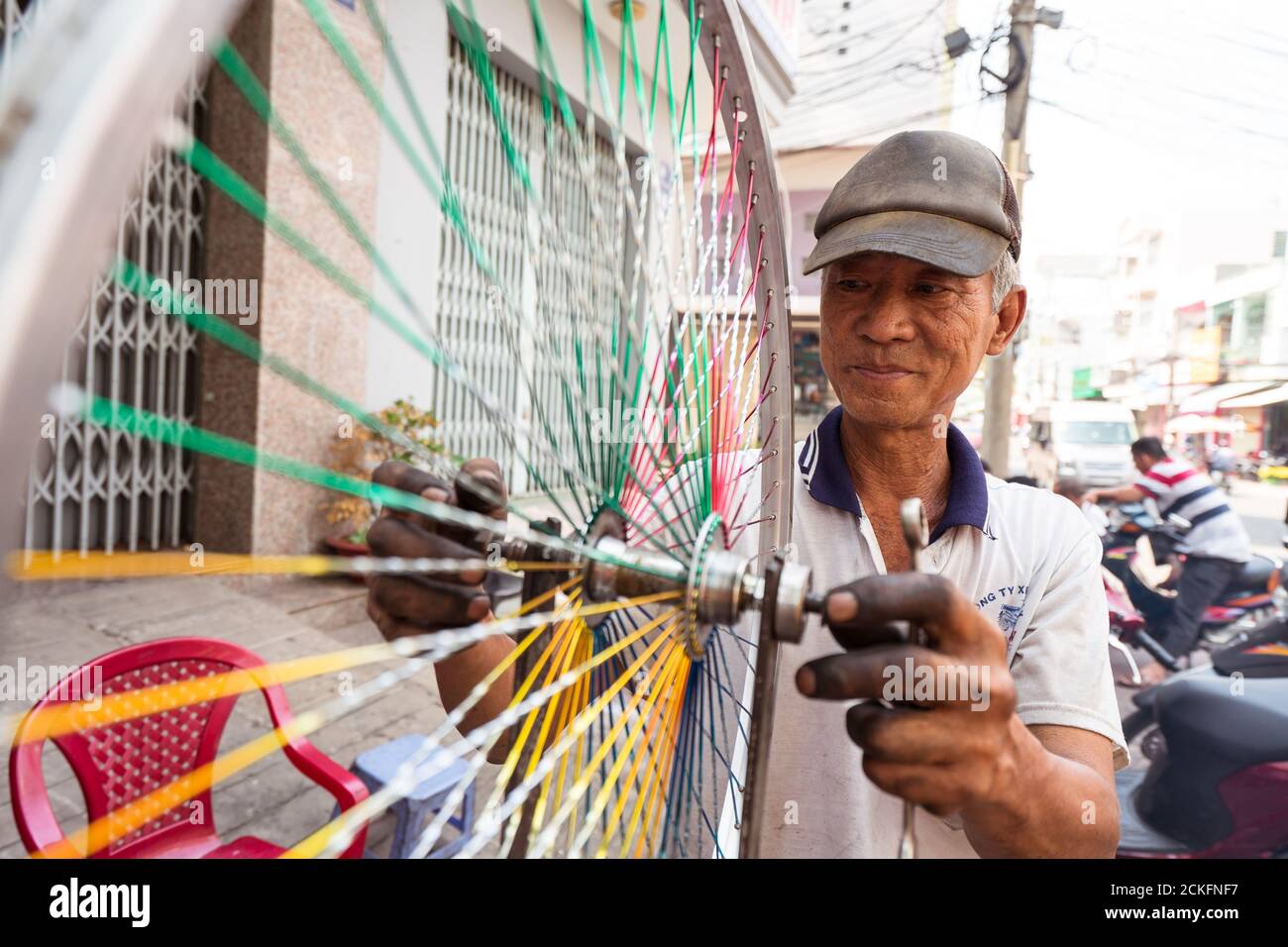 Can Tho / Vietnam January 28, 2020 portrait of vietnamese man fixing
