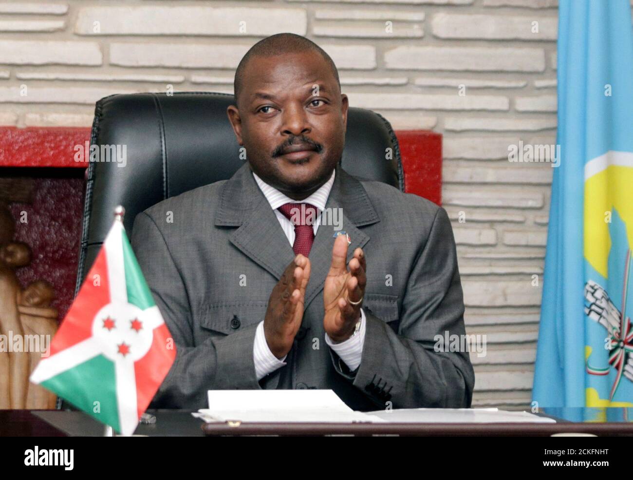 Burundi President Pierre Nkurunziza claps after signing the new constitution at the Presidential Palace in Gitega Province, Burundi June 7, 2018. REUTERS/Evrard Ngendakumana Stock Photo