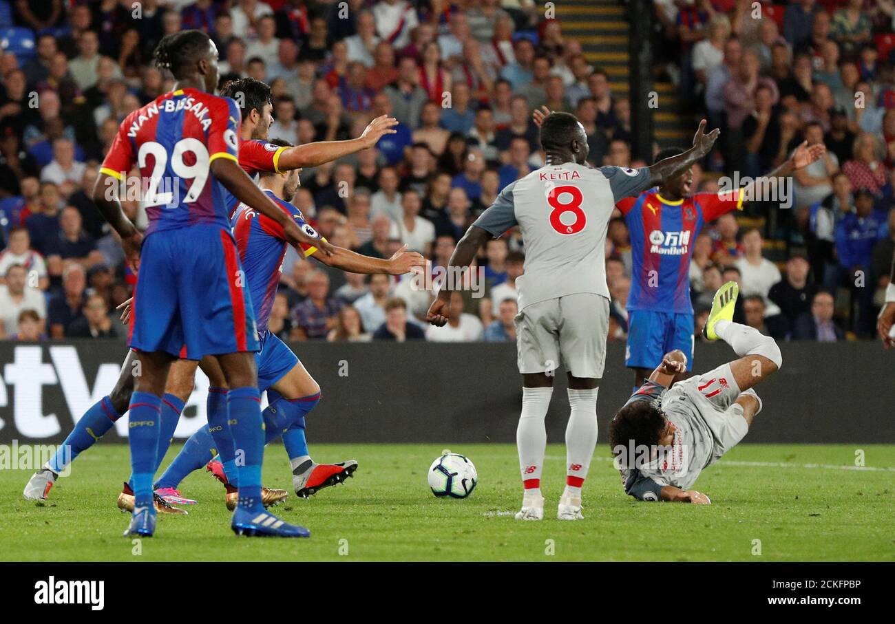 Soccer Football - Premier League - Crystal Palace v Liverpool - Selhurst Park, London, Britain - August 20, 2018  Liverpool's Mohamed Salah is pulled down for a penalty by Crystal Palace's Mamadou Sakho                   Action Images via Reuters/John Sibley  EDITORIAL USE ONLY. No use with unauthorized audio, video, data, fixture lists, club/league logos or 'live' services. Online in-match use limited to 75 images, no video emulation. No use in betting, games or single club/league/player publications.  Please contact your account representative for further details. Stock Photo