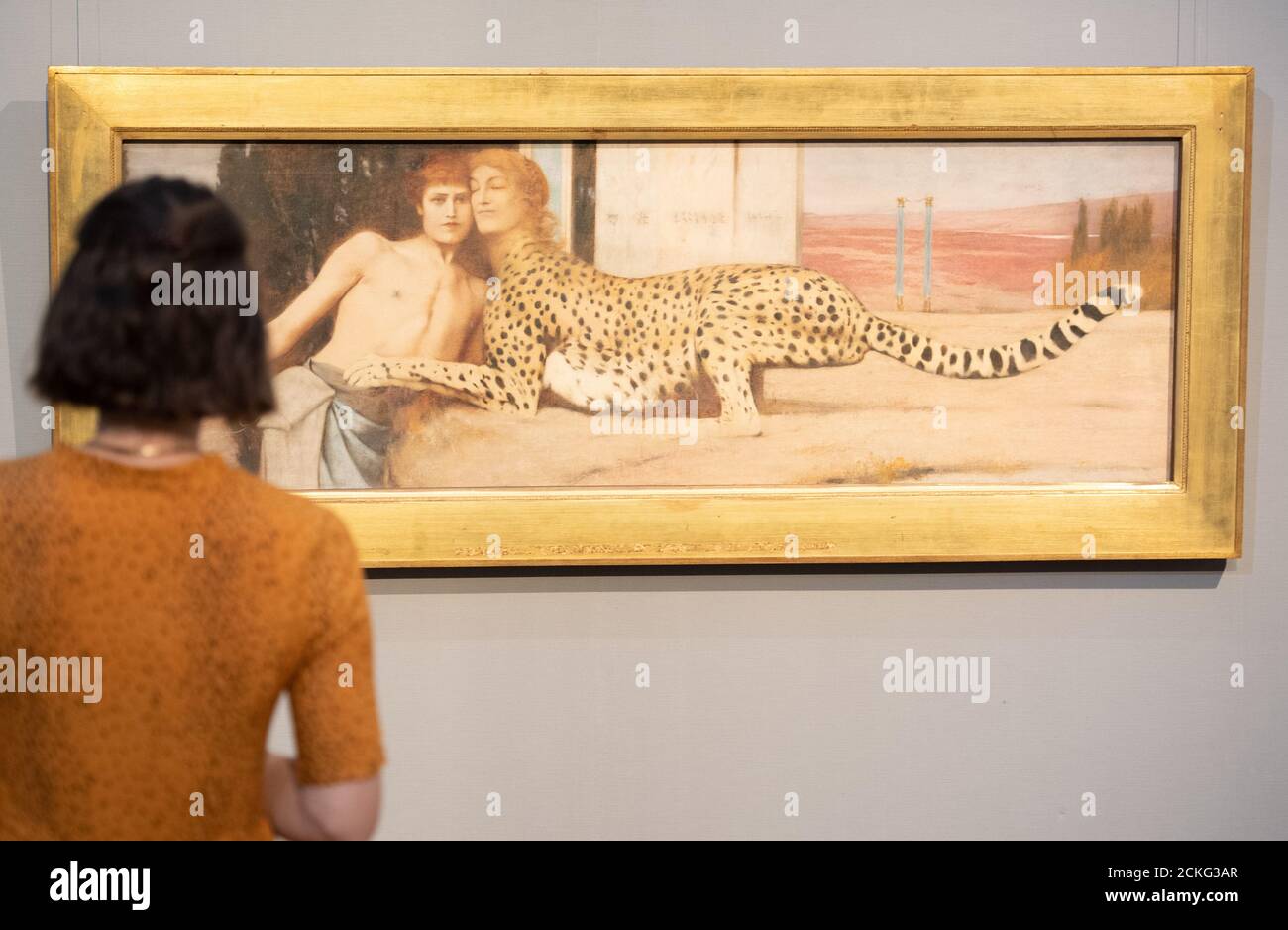 Berlin, Germany. 16th Sep, 2020. A woman looks at the painting 'Liebkosungen' (1896) by Fernand Khnopff in the exhibition 'Dekadenz und dunkle Träume. Belgian Symbolism' in the Old National Gallery. The special exhibition can be seen from 18.9 to 17.1.2021. Credit: Christophe Gateau/dpa/Alamy Live News Stock Photo