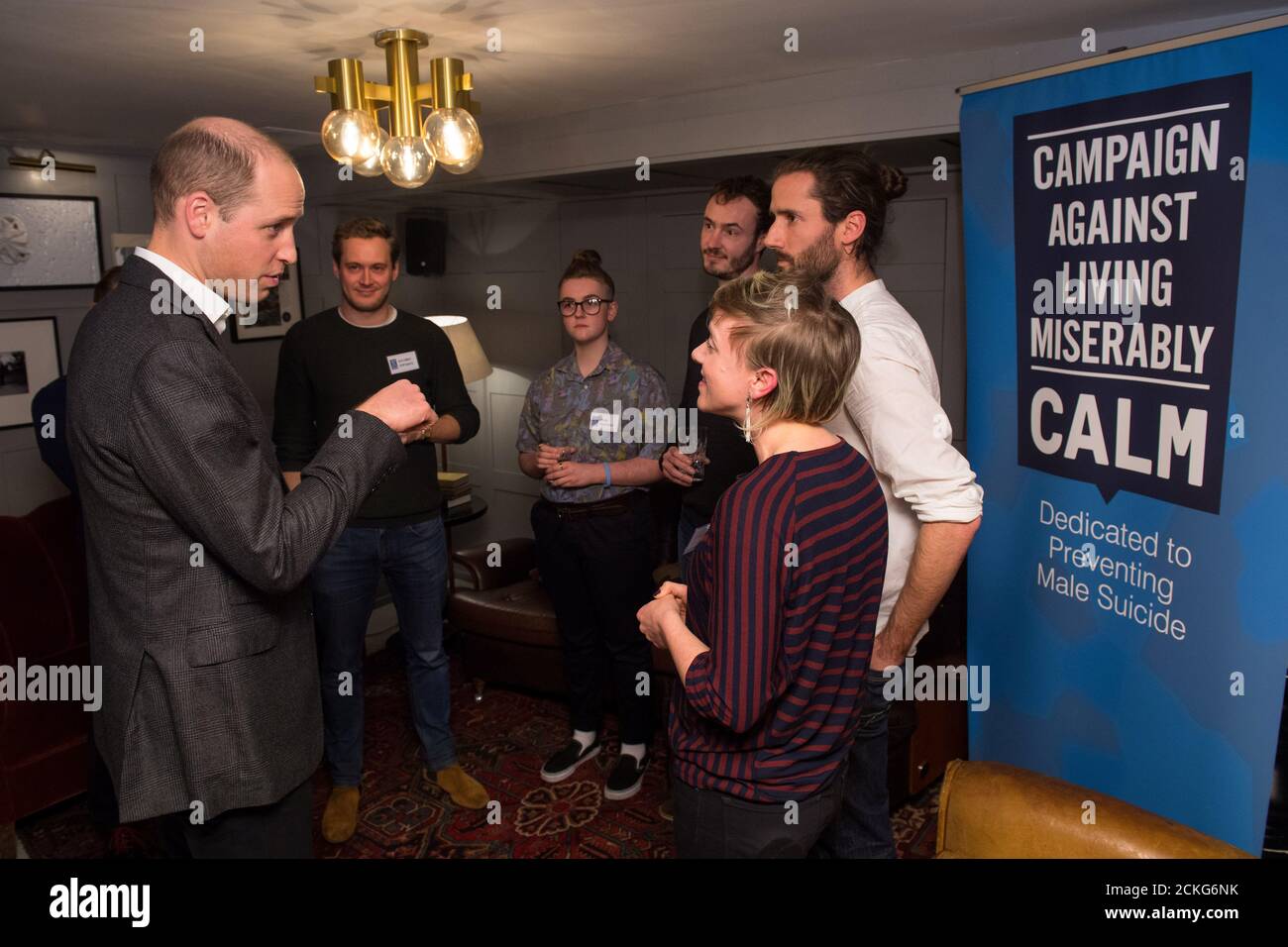 The Duke of Cambridge (L) meets volunteers of 'Campaign Against Living Miserably' (CALM), a charity dedicated to preventing male suicide, to lend his support to their 'Best Man Project' at High Road House, London, Britain January 10, 2018. REUTERS/Dominic Lipinski/Pool Stock Photo