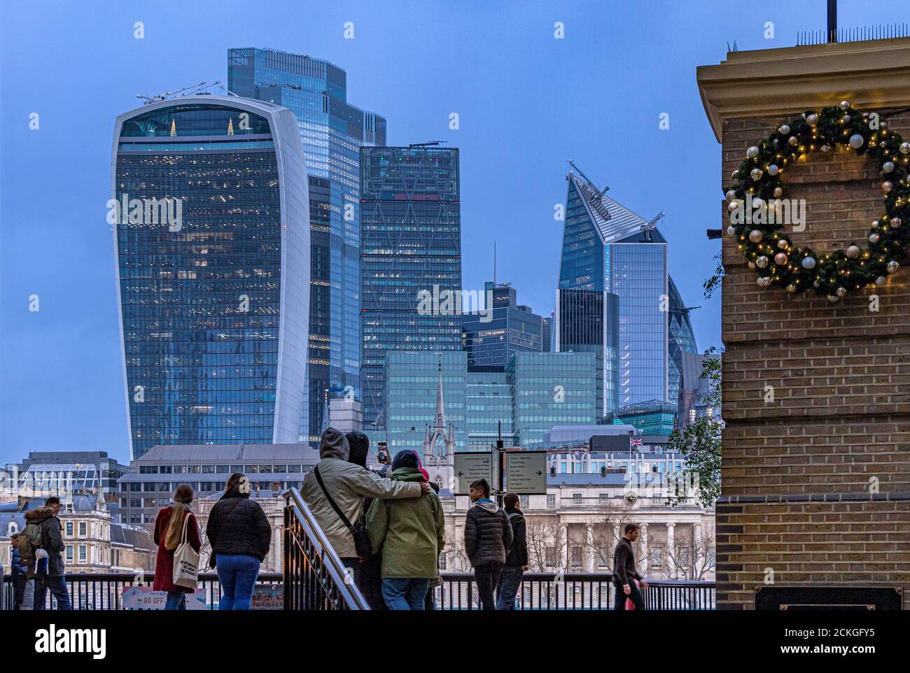 People at the entrance to Hays Galleria with the City of London with the Walkie Talkie and other skyscrapers in the background , City of London,UK Stock Photo
