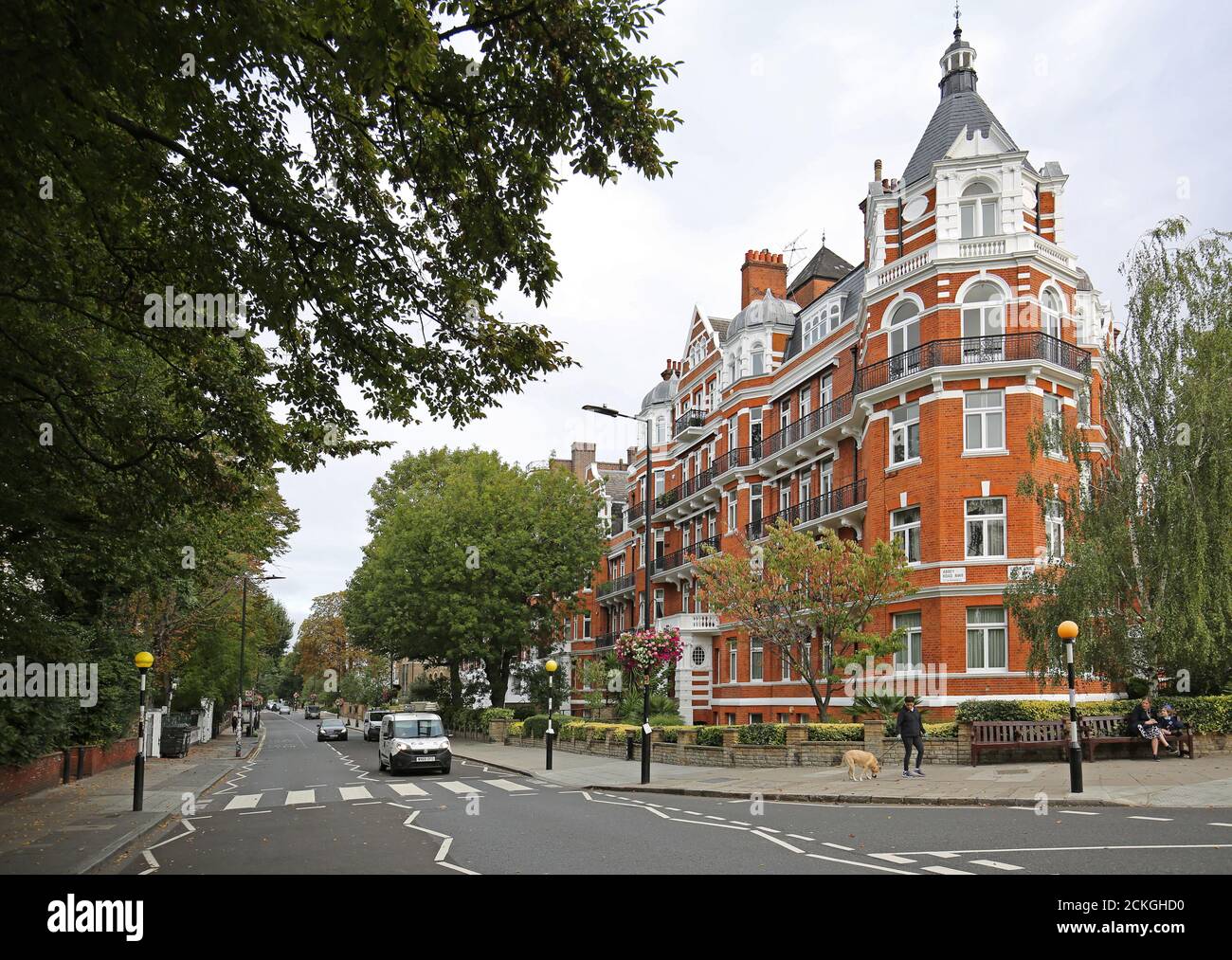 Abbey Road, London. Neville Court, (right) an ornate, newly refurbished 1930s tenement block opposite the zebra crossing made famous by the Beatles. Stock Photo