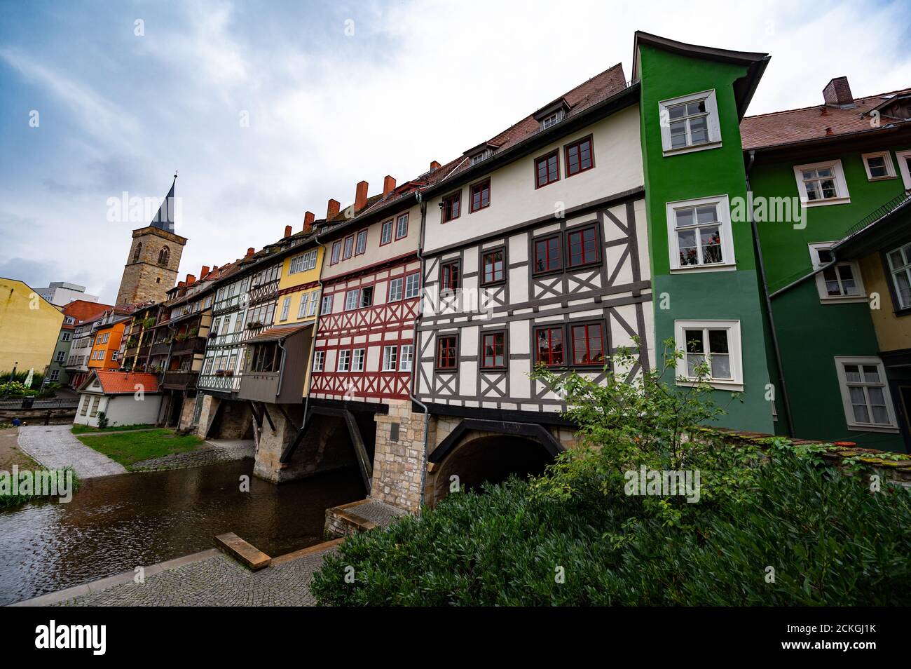 The Krämerbrücke (Merchants' bridge) is a medieval arch bridge in Erfurt, Thuringia in central Germany, which is lined with half timbered shops and ho Stock Photo