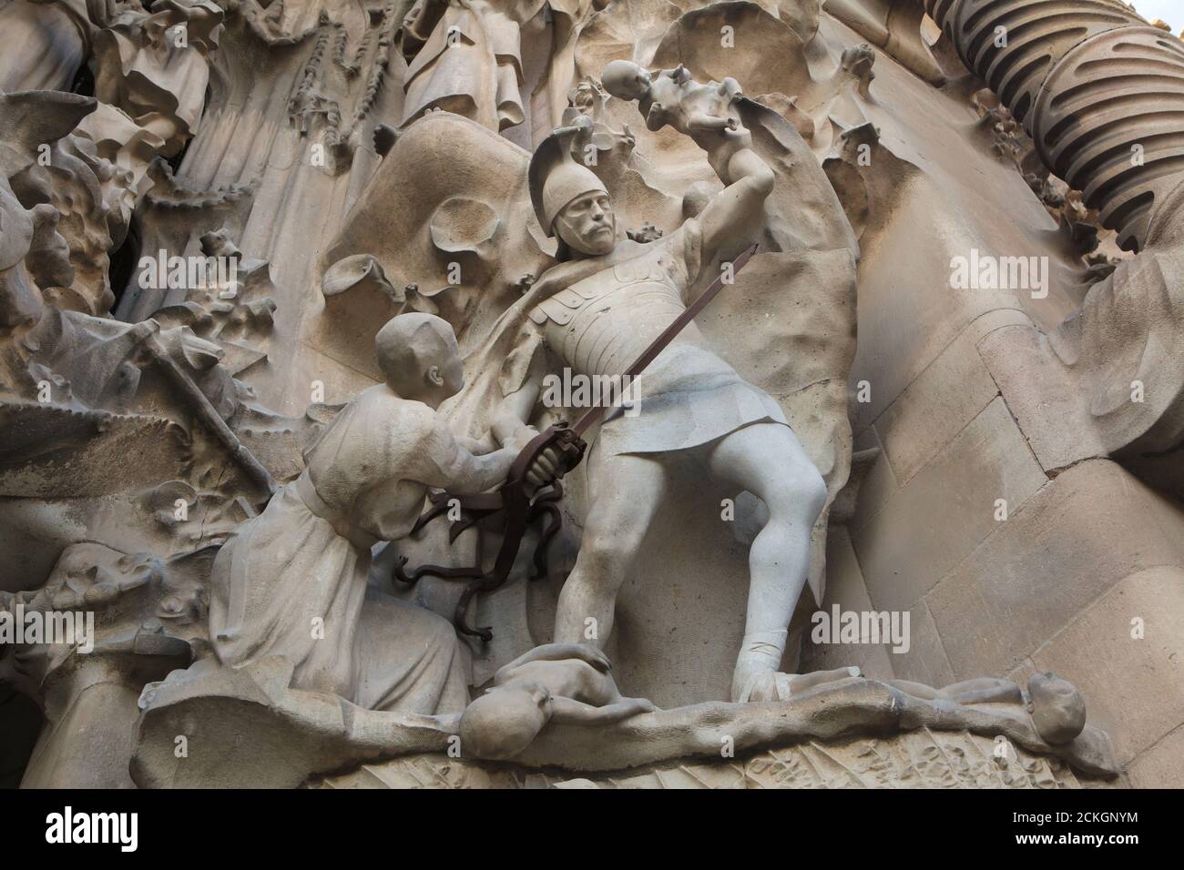 Massacre of the Innocents depicted on the Nativity facade of the Sagrada Família (Basílica de la Sagrada Família) designed by Catalan modernist architect Antoni Gaudí in Barcelona, Catalonia, Spain. The Nativity facade was designed by Antoni Gaudí himself and constructed between 1894 and 1930. The statues were carved by Catalan modernist sculptor Llorenç Matamala i Piñol. Stock Photo