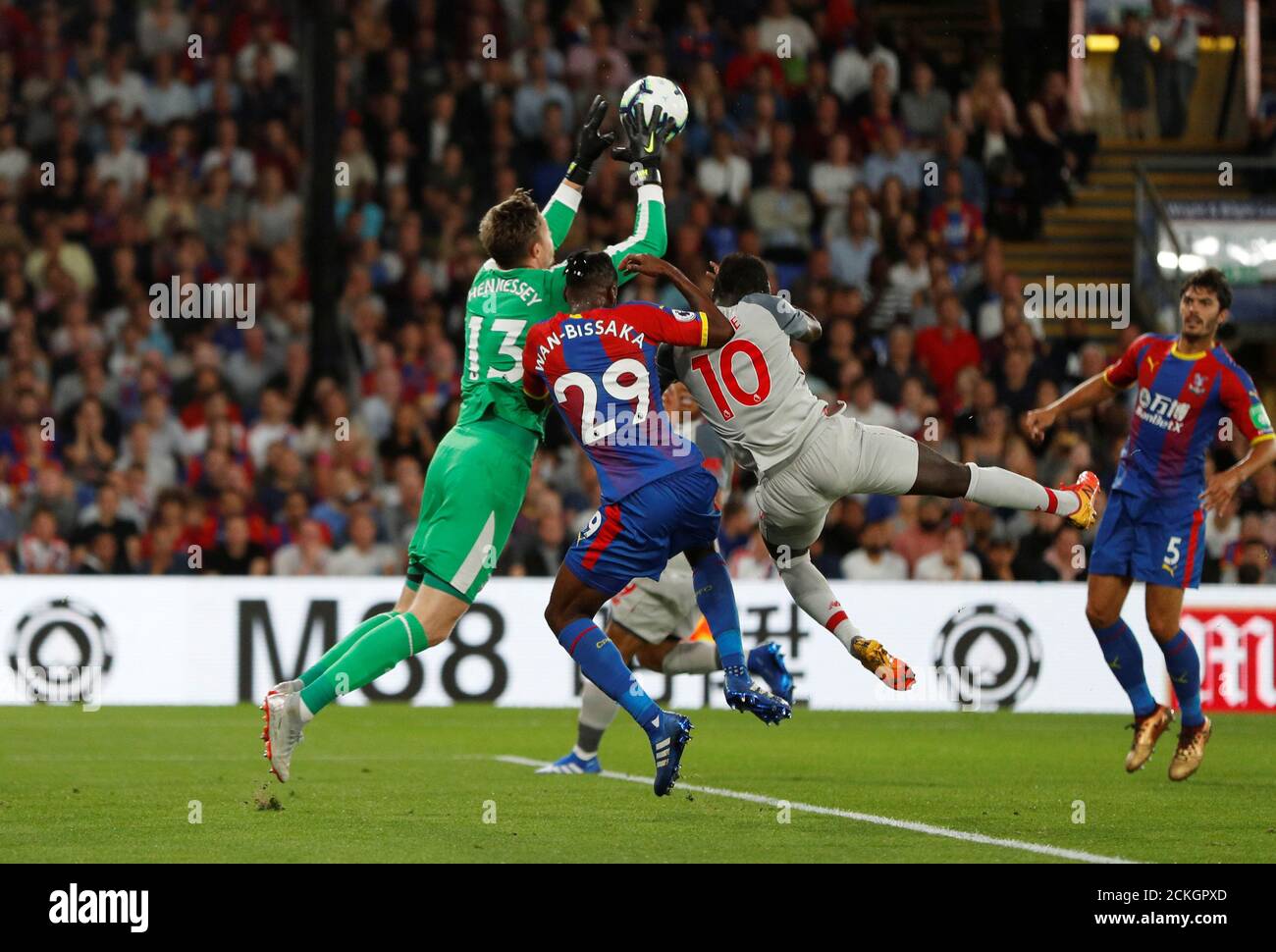 Soccer Football - Premier League - Crystal Palace v Liverpool - Selhurst Park, London, Britain - August 20, 2018  Crystal Palace's Wayne Hennessey in action with Aaron Wan-Bissaka and Liverpool's Sadio Mane              Action Images via Reuters/John Sibley  EDITORIAL USE ONLY. No use with unauthorized audio, video, data, fixture lists, club/league logos or 'live' services. Online in-match use limited to 75 images, no video emulation. No use in betting, games or single club/league/player publications.  Please contact your account representative for further details. Stock Photo