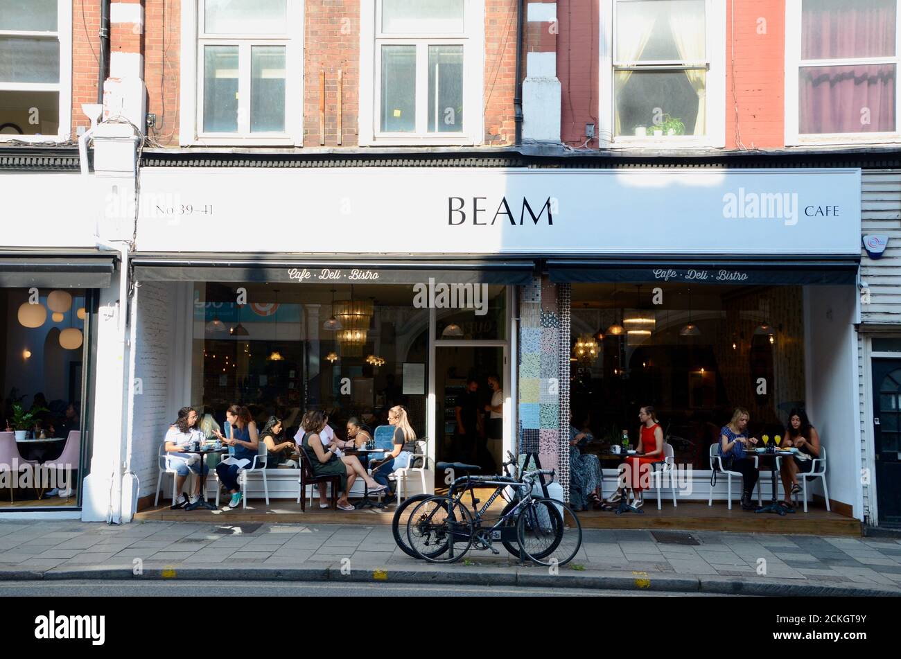 woman diners at beam cafe in crouch end north london N8 england UK
