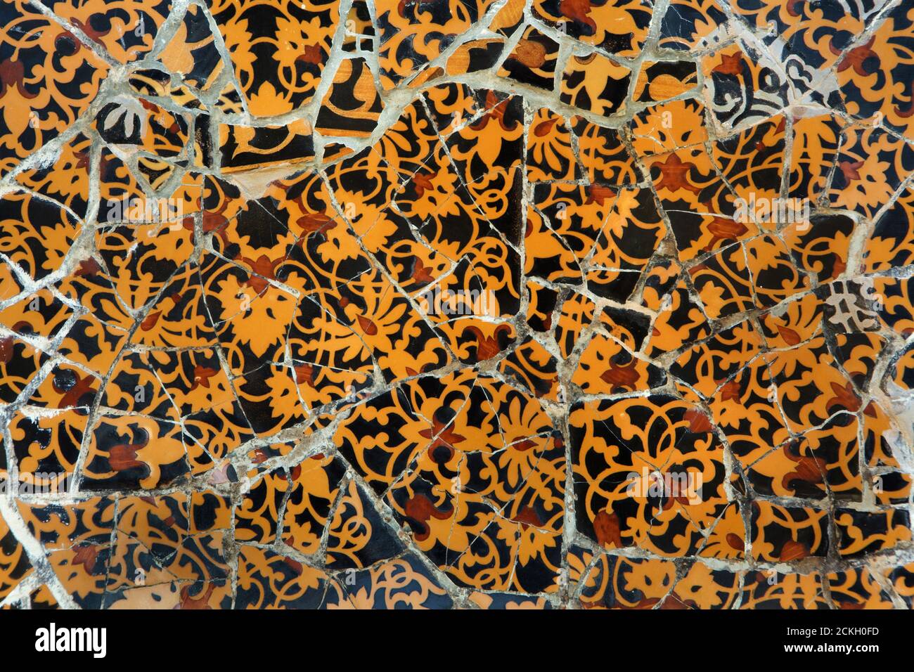 Trencadís mosaic wall on the main staircase in the Park Güell designed by Catalan modernist architect Antoni Gaudí and built between 1900 and 1914 in Barcelona, Catalonia, Spain. Stock Photo