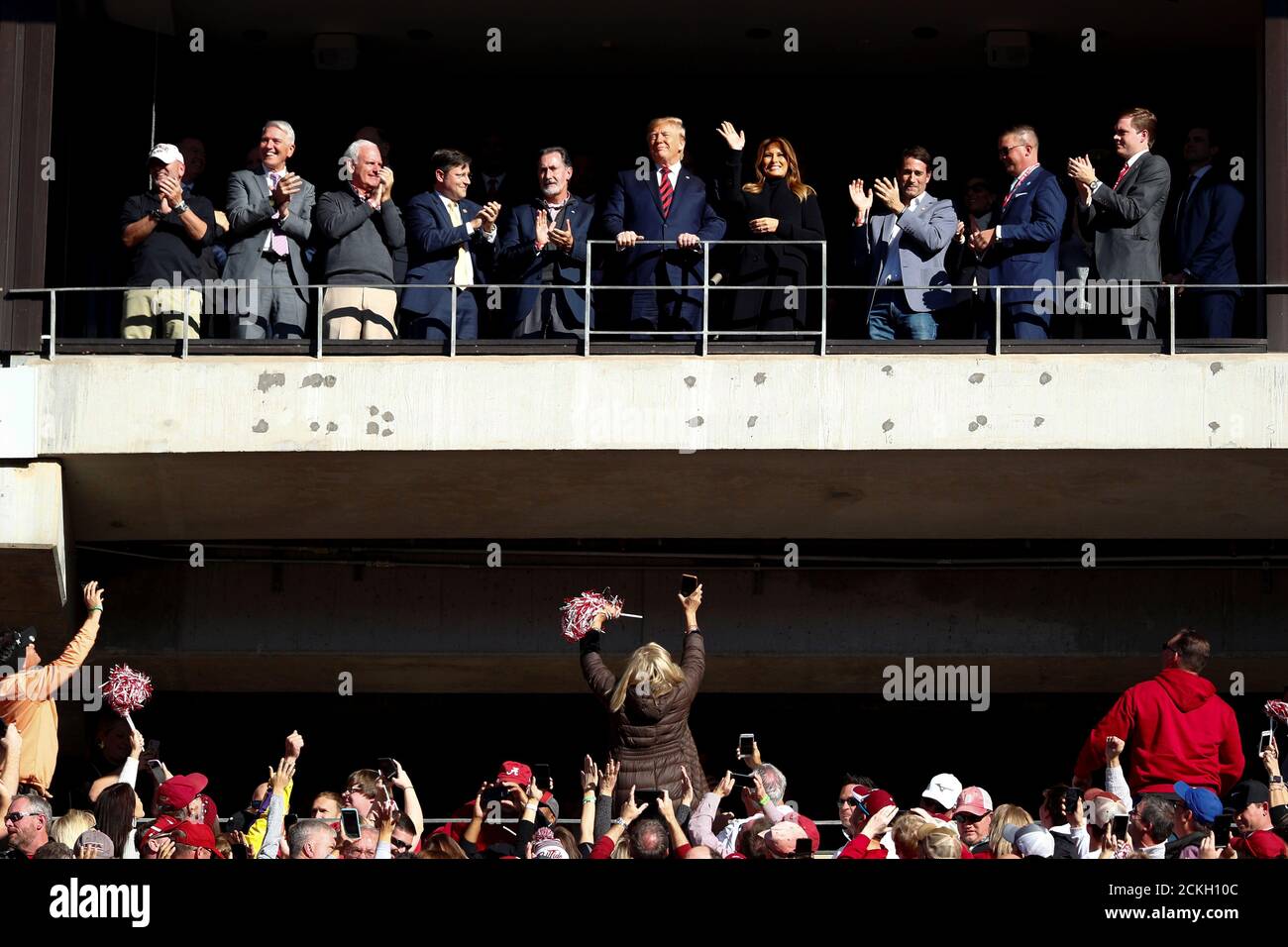 U.S. President Donald Trump and first lady Melania Trump wave to the crowd during an N.C.A.A. Division I college football game between Louisiana State University and University of Alabama at Bryant-Denny Stadium in Tuscaloosa, Alabama, U.S., November 9, 2019. REUTERS/Tom Brenner Stock Photo