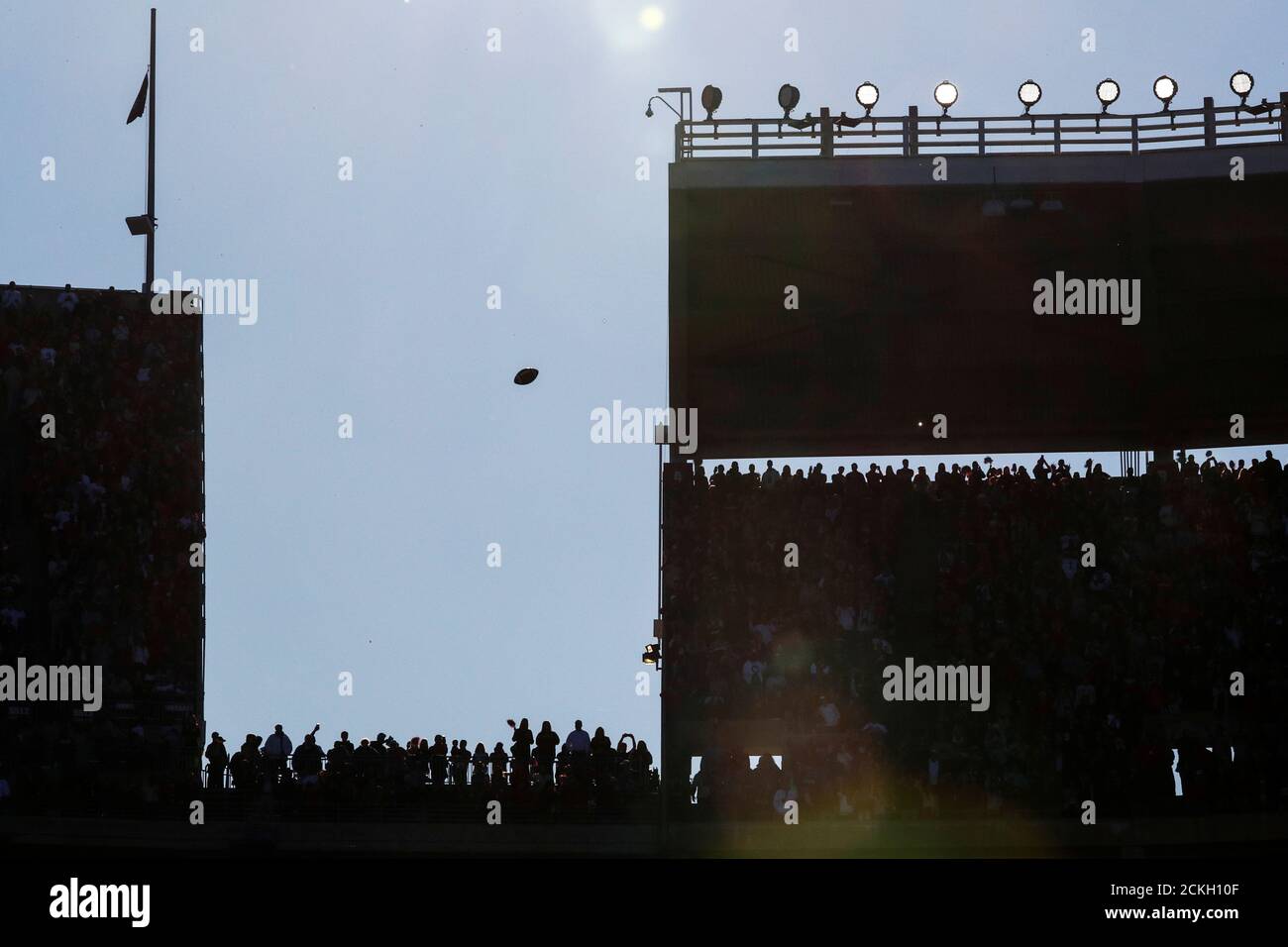 A football flies through the air during a warmup period, during an N.C.A.A. Division I college football game between Louisiana State University and University of Alabama at Bryant-Denny Stadium in Tuscaloosa, Alabama, U.S., November 9, 2019. REUTERS/Tom Brenner Stock Photo
