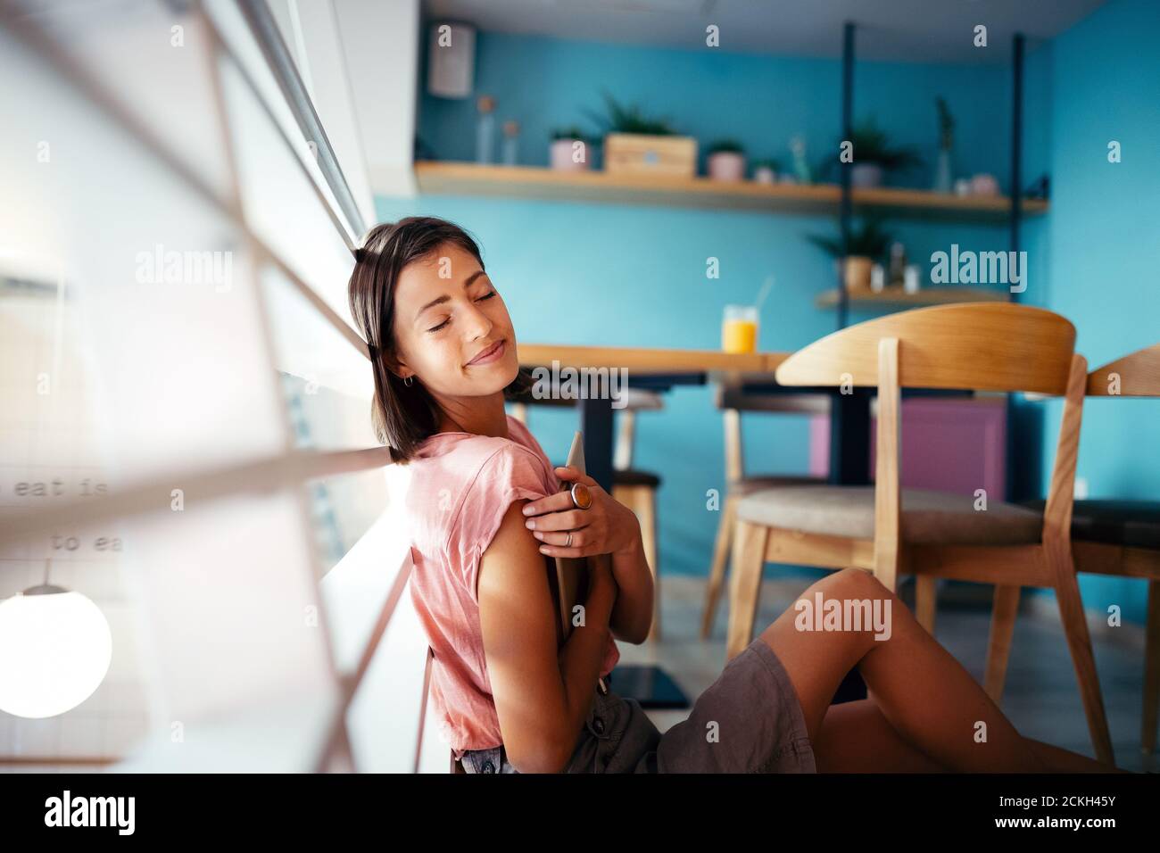 Portrait of pretty student or businesswoman in smart casual using digital tablet Stock Photo