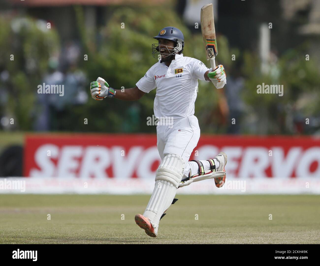 Sri Lanka's Dinesh Chandimal celebrates his century during the third day of their first test cricket match against India in Galle August 14, 2015. REUTERS/Dinuka Liyanawatte Stock Photo