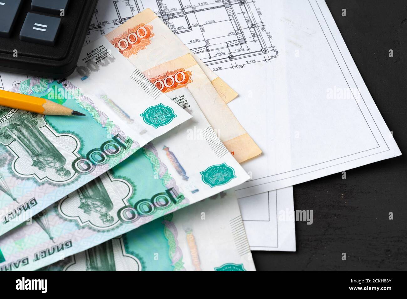 Russian roubles stack on blueprints wth calculator. Renovation, building expenses concept Stock ...