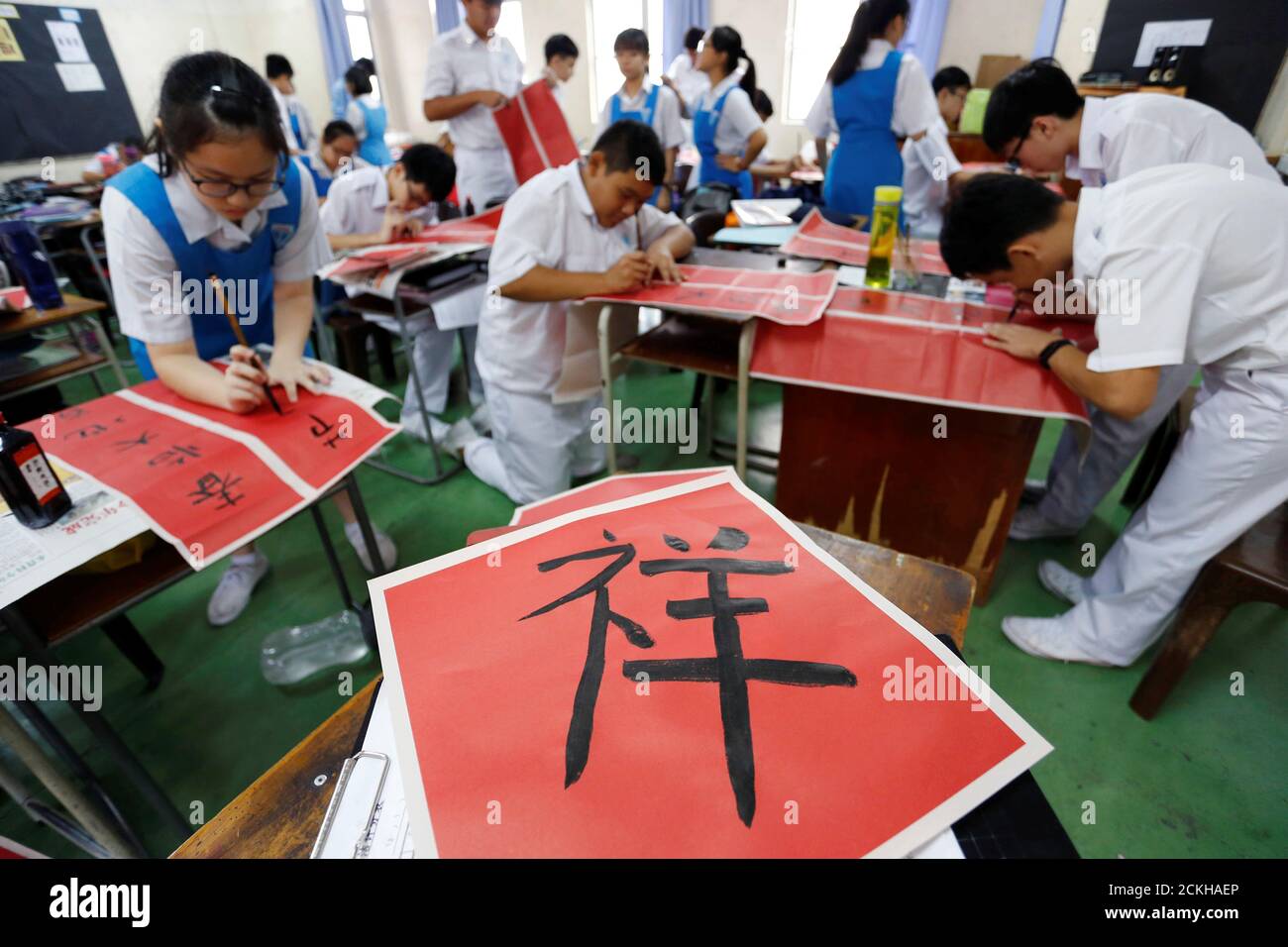 Students participate in a Chinese calligraphy event in conjunction with the  upcoming Chinese Lunar New Year of the Pig, at Tsun Jin High School in  Kuala Lumpur, Malaysia January 18, 2019. REUTERS/Lai