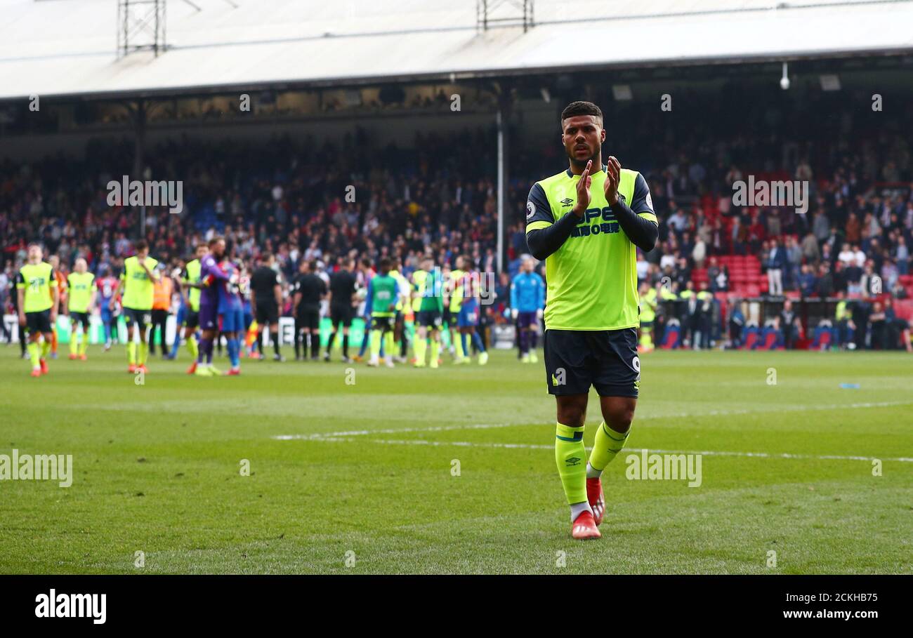Soccer Football - Premier League - Crystal Palace v Huddersfield Town - Selhurst Park, London, Britain - March 30, 2019  Huddersfield Town's Elias Kachunga applauds fans after the match as they are relegated from the Premier League   REUTERS/Hannah McKay  EDITORIAL USE ONLY. No use with unauthorized audio, video, data, fixture lists, club/league logos or 'live' services. Online in-match use limited to 75 images, no video emulation. No use in betting, games or single club/league/player publications.  Please contact your account representative for further details. Stock Photo