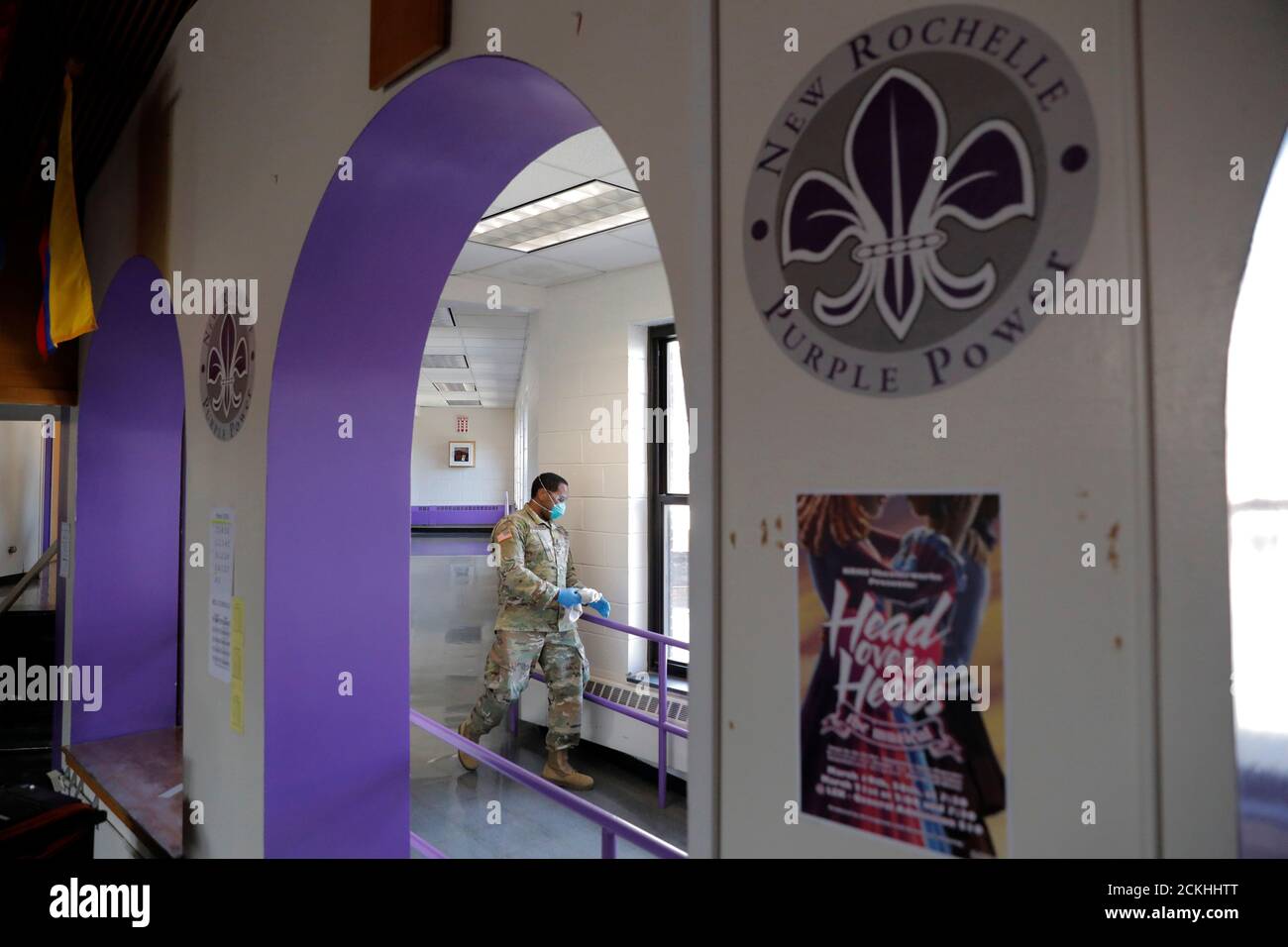 A member of Joint Task Force 2, composed of soldiers and airmen from the New York Army and Air National Guard, works to sanitize the New Rochelle High School during the coronavirus disease (COVID-19) outbreak in New Rochelle, New York, U.S., March 21, 2020. REUTERS/Andrew Kelly Stock Photo