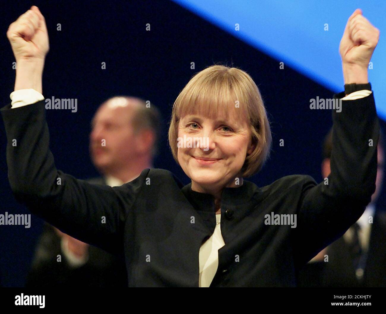Angela Merkel, leader of the conservative Christian Democratic Union (CDU) reacts on the jubilation of about 1000 delegates after her opening speech of the 14th general party meeting of the CDU in Dresden, December 3, 2001. The conservatives, struggling to rebuild after a funding scandal around former chancellor Helmut Kohl and trailing behind Schroeder in the polls, insist the event will focus on immigration and Social Democratic chancellor Schroeder's failure to cut unemployment. REUTERS/Arnd Wiegmann REUTERS  KP/FMS Stock Photo