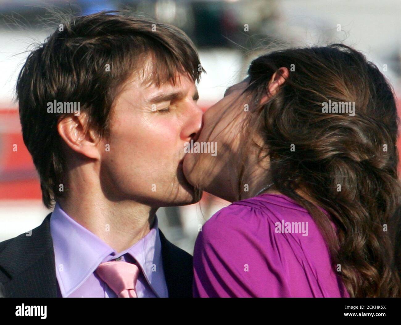 Hollywood film star Tom Cruise kisses US actress Katie Holmes as he arrives  for the French premiere of his latest movie in Marseille. Hollywood film  star Tom Cruise (L) kisses U.S. actress