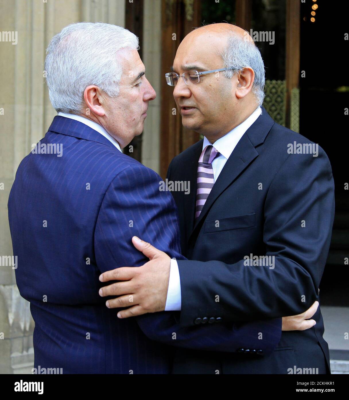 Mitch Winehouse (L), the father of deceased British singer Amy Winehouse, is greeted by MP Keith Vaz as he arrives at the Houses of Parliament in London August 1, 2011. In the wake of singer Amy Winehouse's death, her father Mitch went to Westminster on Monday to press politicians to do more for young people needing help with drug and alcohol problems.    REUTERS/Stefan Wermuth (BRITAIN - Tags: POLITICS ENTERTAINMENT SOCIETY) Stock Photo