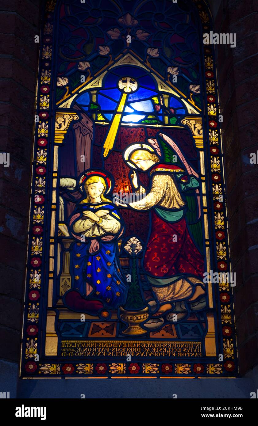 The Annunciation stained glass window seen from outside at night, St. Mary Immaculate RC Church, Warwick, UK Stock Photo