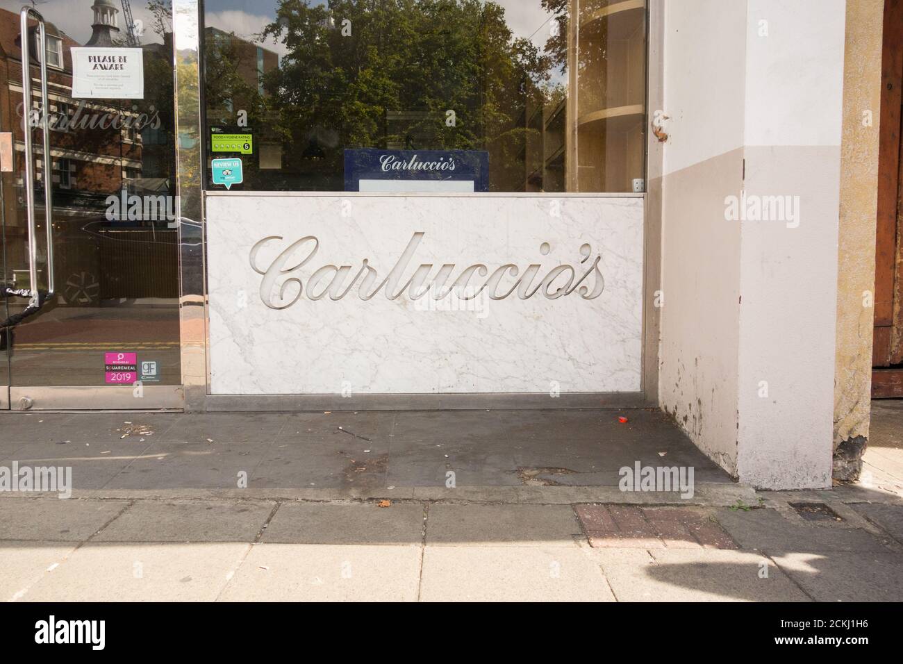 Signage outside the former Carluccio's Restaurant on The Green, Ealing, London, W5, U.K. Stock Photo