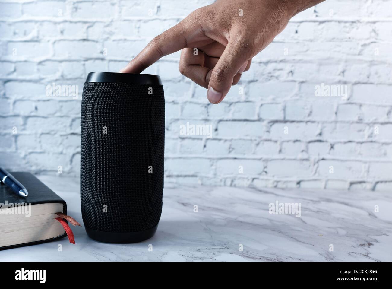 Mans hand using smart speaker hi-res stock photography and images - Alamy