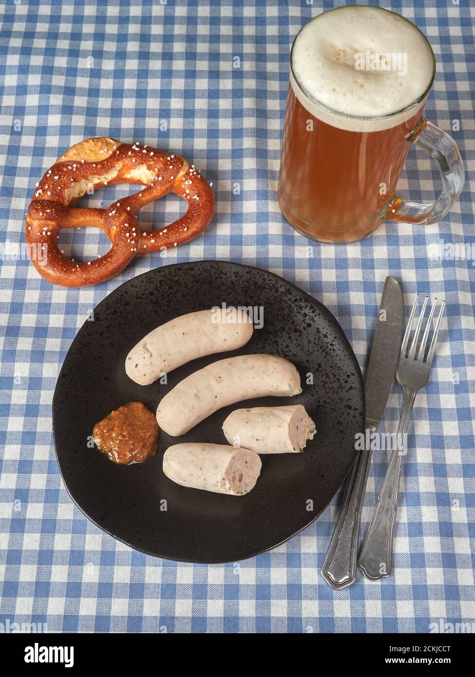Bavarian white sausages (weisswurst) with sweet mustard and pretzels Stock Photo