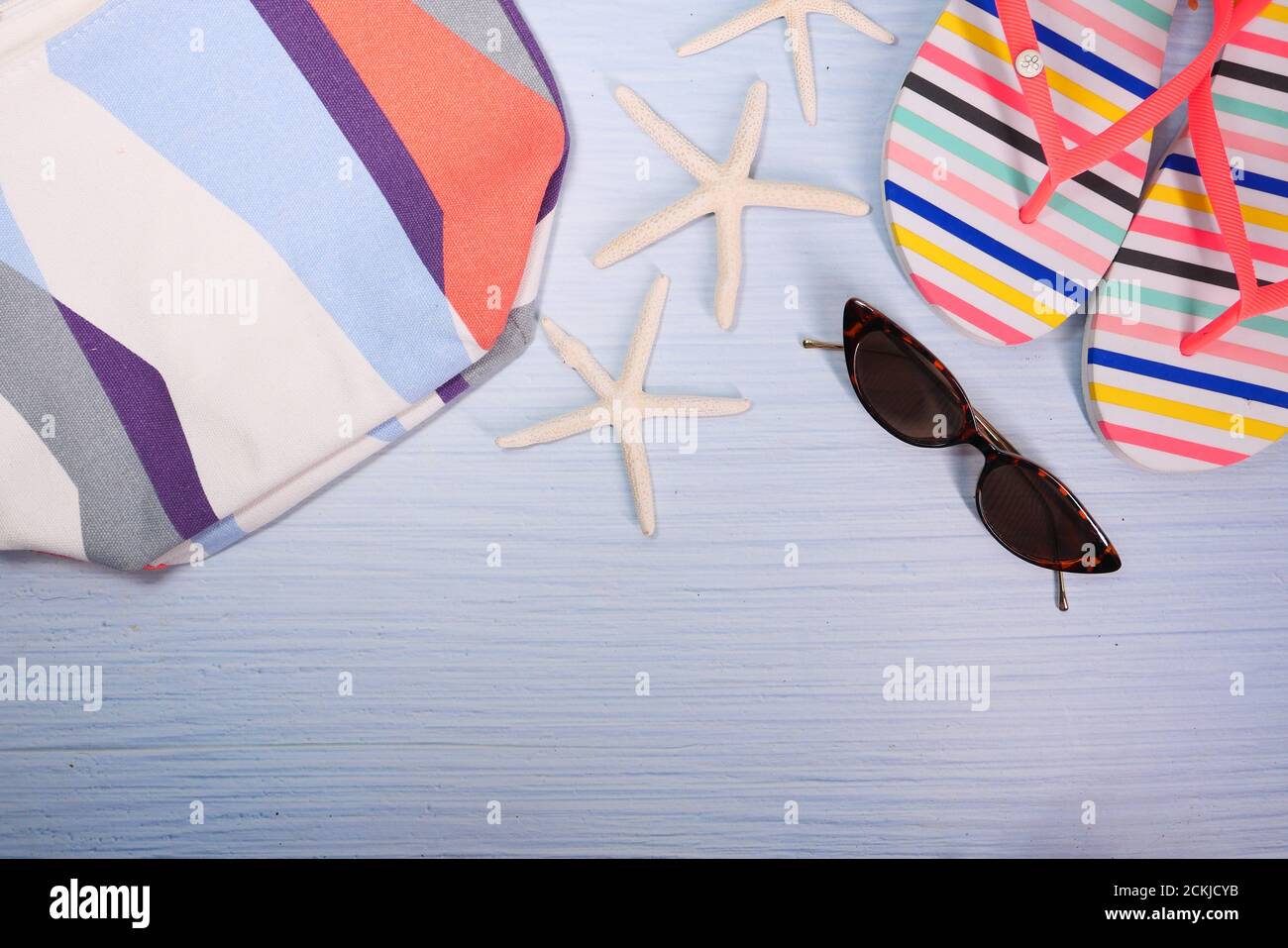 flat composition of summer beach accessories on table. Stock Photo