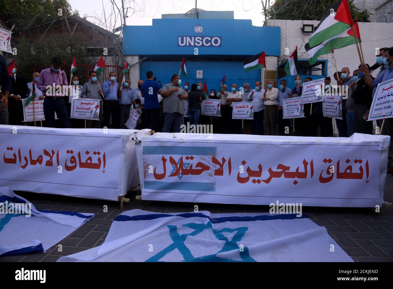 September 15, 2020: Gaza, Palestine.15 September 2020. Palestinians hold a protest outside the UN headquarters in Gaza City as the UAE and Bahrain sign their normalisation agreements with Israel in Washington. Protesters burnt the Israeli flag and  carried banners denouncing the deal as ''the deal of shame'', and the normalisation of ties as a betrayal by the Arab states. While the White House has described the accords as a ''declaration of peace'', Palestinians have fully rejected them as they feel even more isolated in resisting the Israeli occupation, while their leaders have called for a l Stock Photo