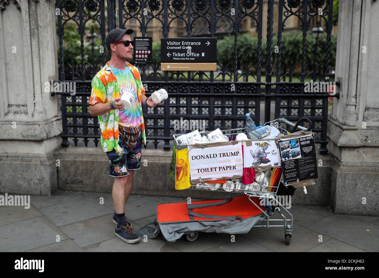 A man raising mental health awareness campaigner, sells Donald Trump themed toilet paper rolls outside the Houses of Parliament in London, Britain July 9, 2019. REUTERS/Simon Dawson Stock Photo