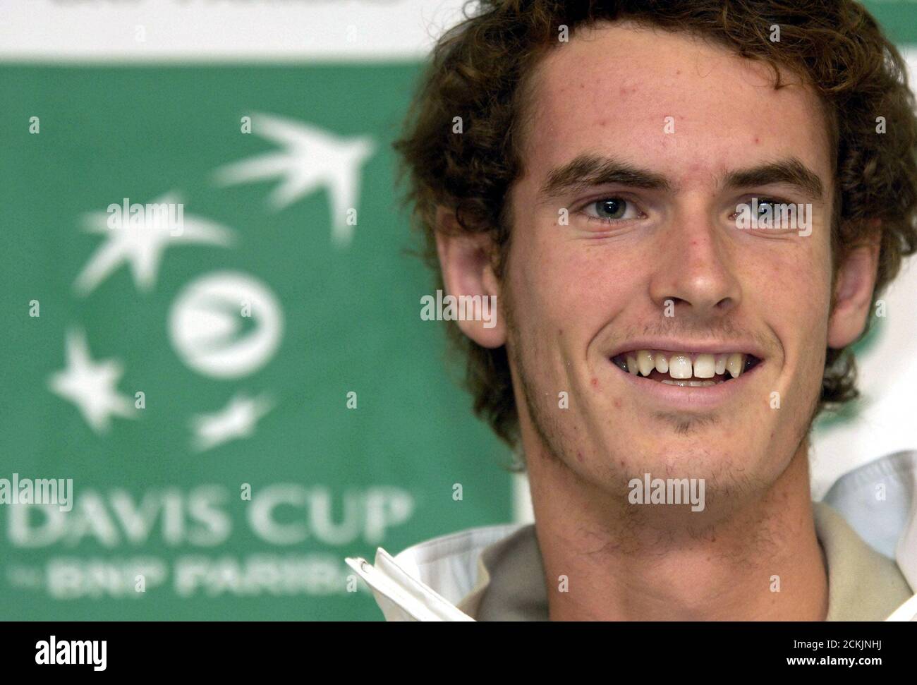 British tennis player Andy Murray smiles during a news conference of the British Davis Cup team at Palexpo in Geneva.  British tennis player Andy Murray smiles during a news conference of the British Davis Cup team at Palexpo in Geneva, Switzerland, September 21, 2005. Great Britain will play against Switzerland in the Davis Cup World Group Play-offs set to be played between 23-25 September 2005 in Geneva. REUTERS/Denis Balibouse Stock Photo
