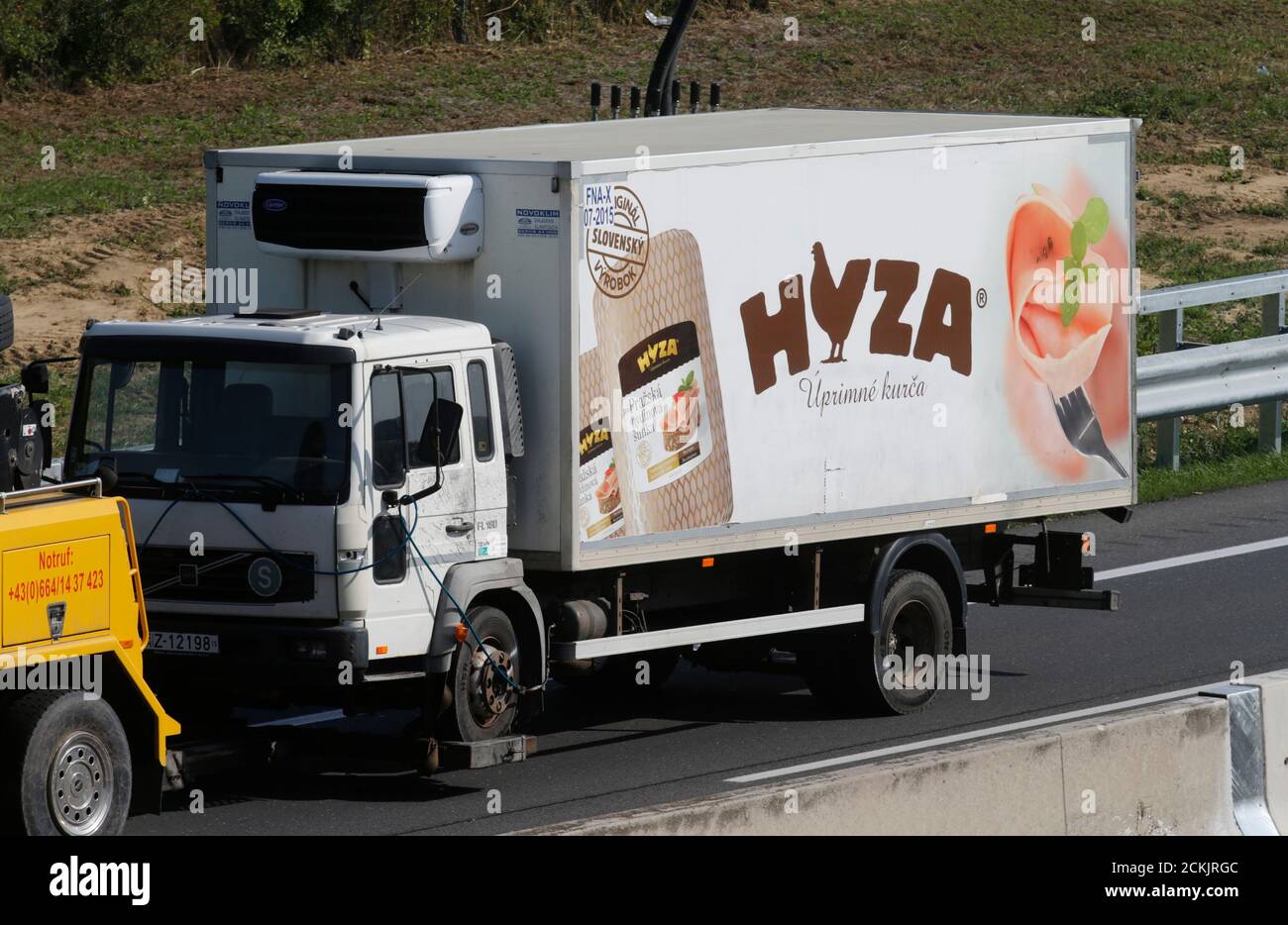 A truck, in which up to 50 migrants were found dead on a motorway near  Parndorf, Austria August 27, 2015, is towed away. As many as 50 refugees  were found dead in