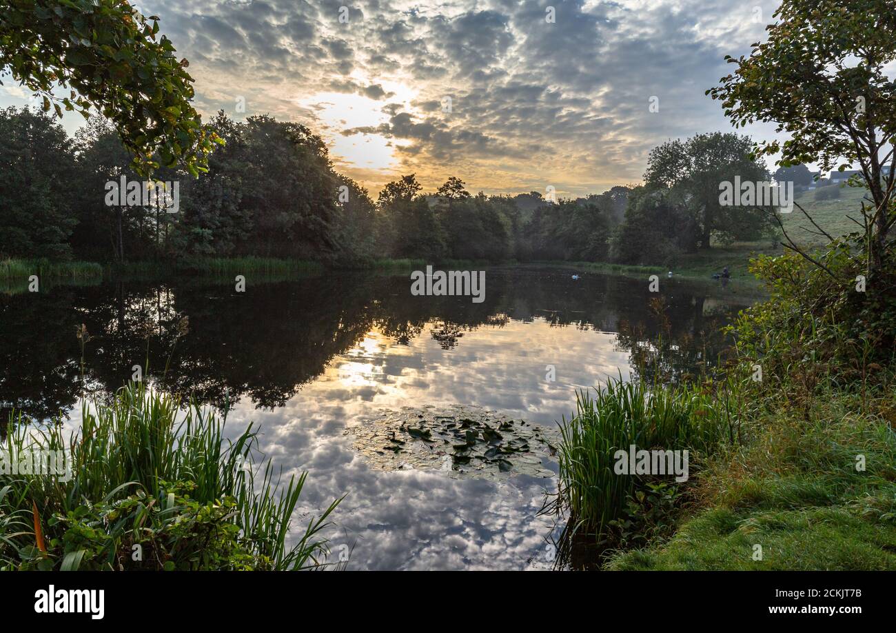 Reflections on Tong Park Dam, Baildon, Yorkshire, England Stock Photo