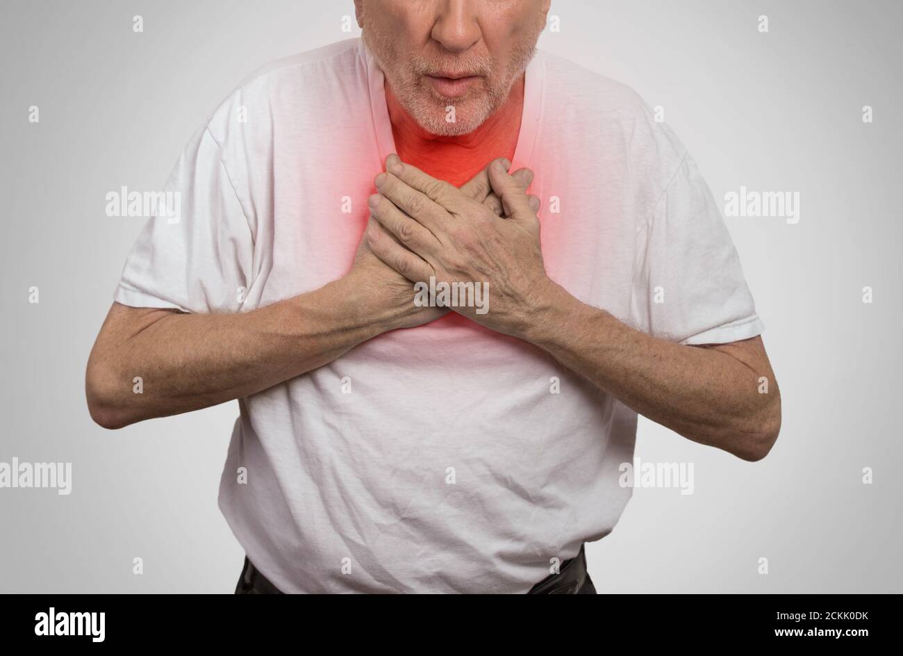 Closeup portrait sick old man, elderly guy, having severe infection, chest pain, looking miserable unwell, trying to catch his breath isolated on gray Stock Photo
