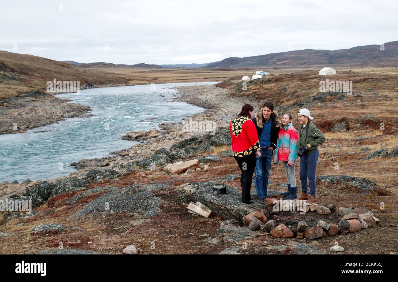 Liberal leader and Canadian Prime Minister Justin Trudeau, accompanied by his kids Ella-Grace Margaret and Xavier James and by Nunavut's Liberal candidate Megan Pizzo-Lyall, is seen during an election campaign visit to Iqaluit, Nunavut, Canada October 8, 2019. REUTERS/Stephane Mahe Stock Photo