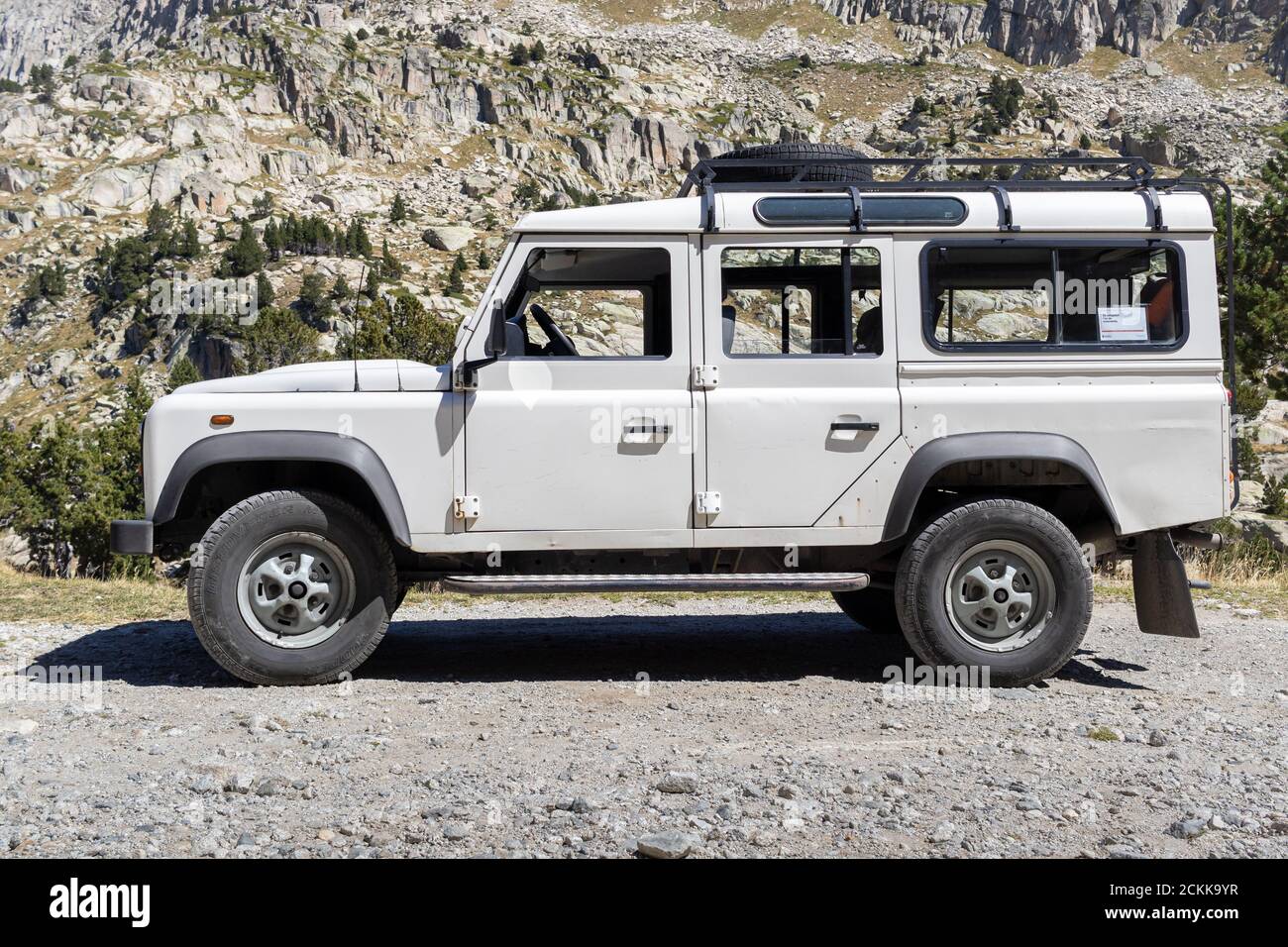 ESPOT, SPAIN-SEPTEMBER 5, 2020: Land Rover Defender 110 Station wagon standing on a mountain road (Side view) Stock Photo