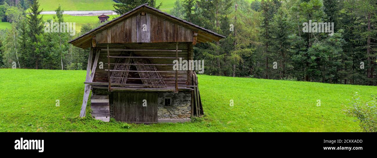 old traditional hay barn on a meadow in the Lesachvalley near Maria Luggau in Carinthia, Austria Stock Photo